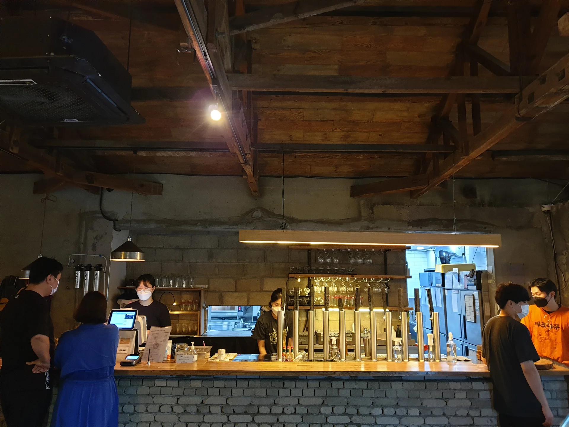 Wrap your phone in the cozy, Instagram-worthy atmosphere of Korean cafe culture. Korea's cafes are more than coffee shops — they're design experiences. These wallpapers feature warm interior light falling on minimalist wooden counters, perfectly crafted latte art in handmade ceramic cups, floor-to-ceiling windows overlooking quiet streets, and rooftop terraces with city panoramas.

From industrial-chic converted warehouses in Seongsu to tiny hidden basement cafes in Ikseon-dong, each image captures the aesthetic sensibility that makes Korean cafe design world-famous. Trailing plants, warm Edison bulbs, curated book walls, and the soft golden glow of afternoon light create scenes you'll want to stare at. Download these free Korean cafe wallpapers for a phone background that feels like a warm hug., Seoul — Free Korean aesthetic wallpaper