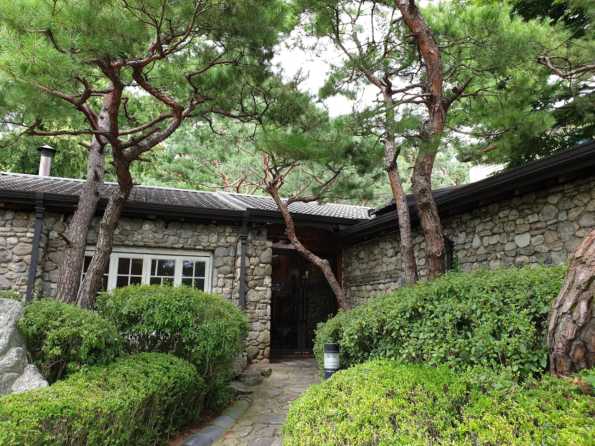 Explore Korea's architectural landscape through stunning phone wallpapers that span centuries of design. From the sleek glass curtain walls of Gangnam's skyscrapers to the raw concrete forms of brutalist apartment complexes, these images capture how Korea blends cutting-edge modernity with bold structural expression.

Look closer and you'll discover geometric patterns in subway station ceilings, sweeping curves of the Dongdaemun Design Plaza, and the quiet symmetry of traditional gate structures standing beside high-rises. Whether you're drawn to minimalist Korean design or dramatic urban geometry, these free aesthetic wallpapers transform your phone background into a gallery of architectural photography., Unknown — Free Korean aesthetic wallpaper