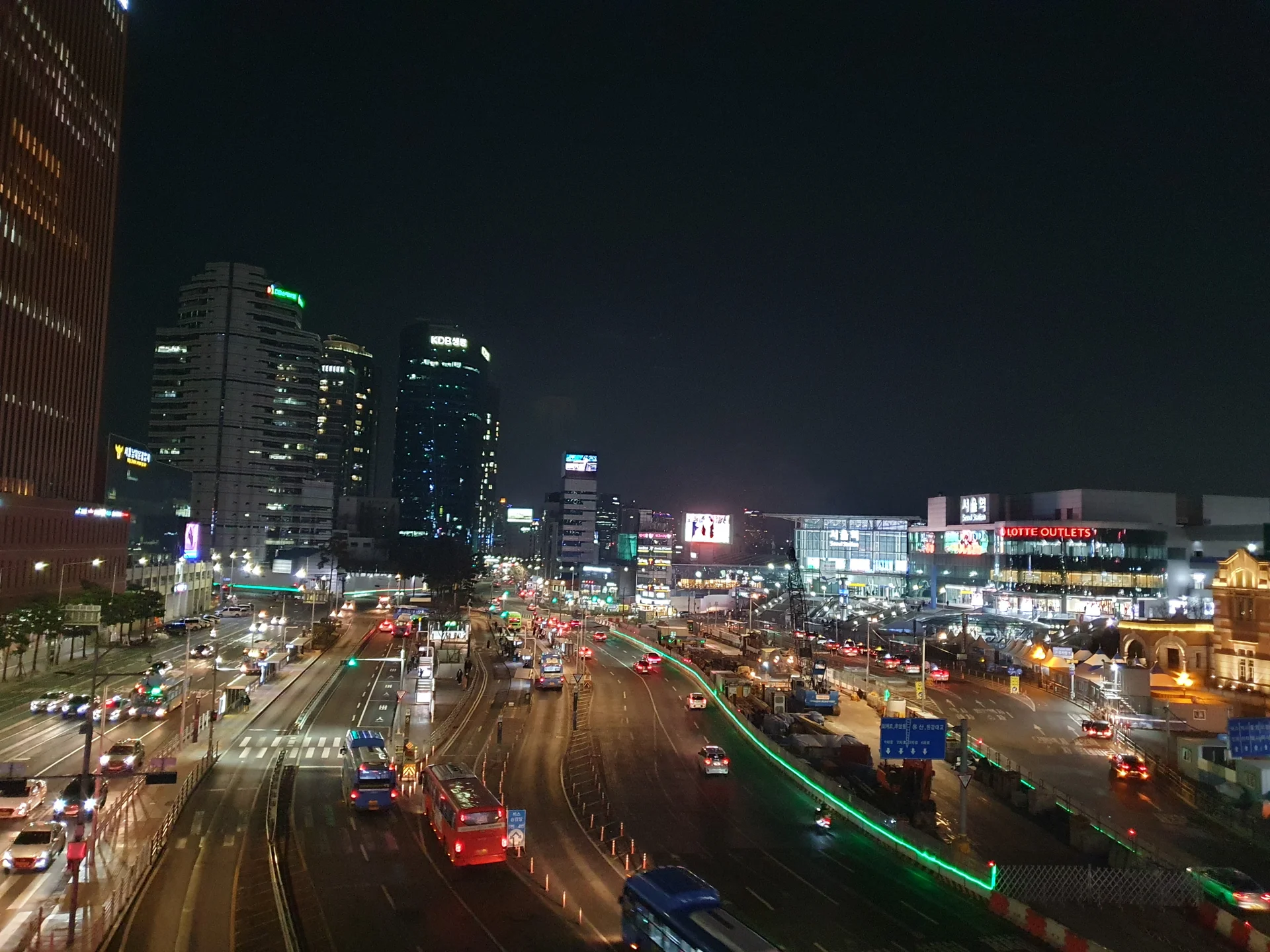 Light up your phone with the electric energy of Seoul after dark. These Korean nightscape wallpapers capture the city at its most cinematic — neon signage stacking up narrow alleyways, glowing street food stalls sending steam into cold night air, illuminated bridges spanning the Han River, and the shimmering towers of Gangnam reflected in rain-wet streets.

Seoul's nighttime personality is bold, colorful, and endlessly photogenic. You'll find the moody glow of Itaewon bars, the cyberpunk atmosphere of Euljiro's industrial blocks, and panoramic cityscapes from hilltop viewpoints where the city stretches to the horizon in every direction. Free download these aesthetic Seoul night wallpapers for a phone background that pulses with urban energy., Seoul, Seoul Station — Free Korean aesthetic wallpaper