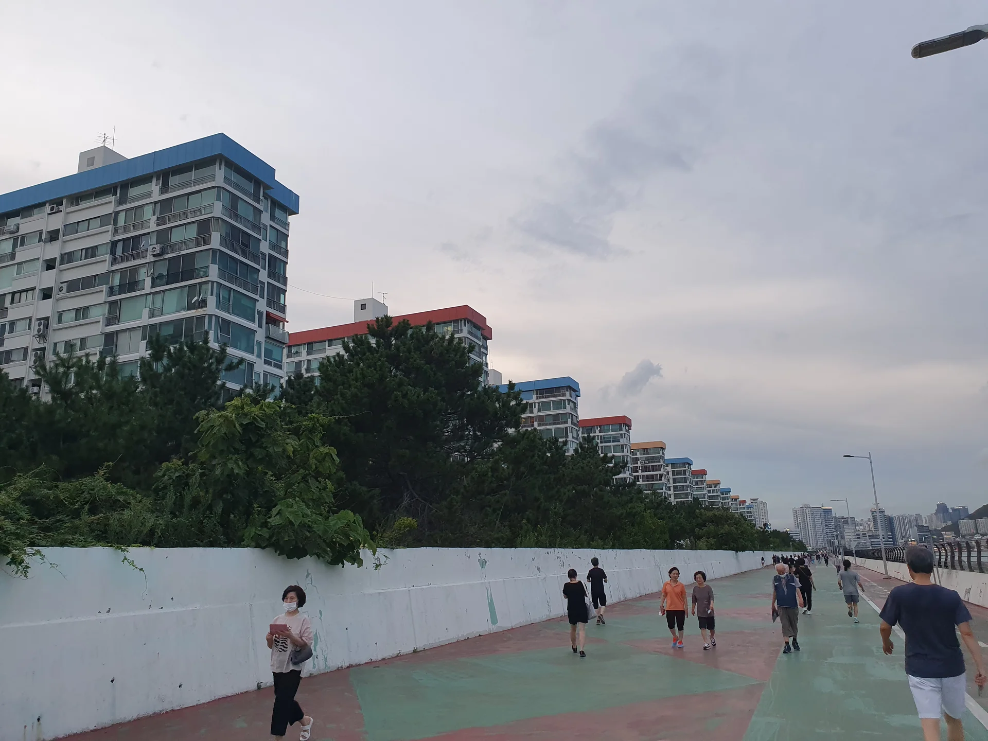 Bring the Korean coastline to your phone with these breathtaking ocean wallpapers. Korea is surrounded by water on three sides, and this collection captures it all — the turquoise shallows of Jeju's beaches, dramatic basalt cliffs plunging into the East Sea, tranquil fishing harbors at dawn, and endless Pacific horizons glowing under golden light.

These photos feature crashing waves against volcanic rock formations, serene island silhouettes at sunset, lighthouse beacons cutting through coastal fog, and the mirror-still surface of sheltered bays reflecting cotton-candy skies. Download these free Korean sea wallpapers for an aesthetic phone background that carries the calm and power of the ocean wherever you go., Busan — Free Korean aesthetic wallpaper