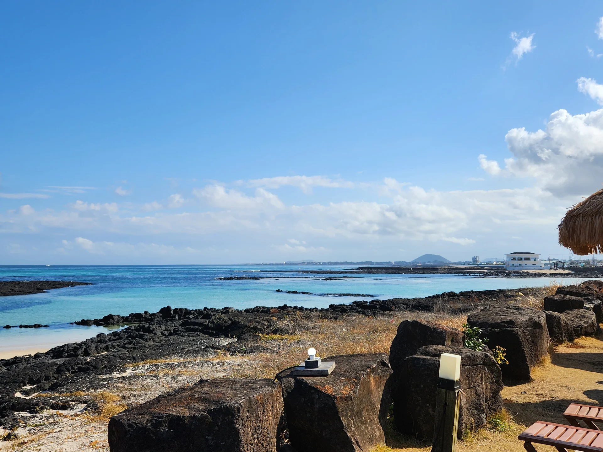 Bring the Korean coastline to your phone with these breathtaking ocean wallpapers. Korea is surrounded by water on three sides, and this collection captures it all — the turquoise shallows of Jeju's beaches, dramatic basalt cliffs plunging into the East Sea, tranquil fishing harbors at dawn, and endless Pacific horizons glowing under golden light.

These photos feature crashing waves against volcanic rock formations, serene island silhouettes at sunset, lighthouse beacons cutting through coastal fog, and the mirror-still surface of sheltered bays reflecting cotton-candy skies. Download these free Korean sea wallpapers for an aesthetic phone background that carries the calm and power of the ocean wherever you go., Haemajihaean-ro, Jeju — Free Korean aesthetic wallpaper