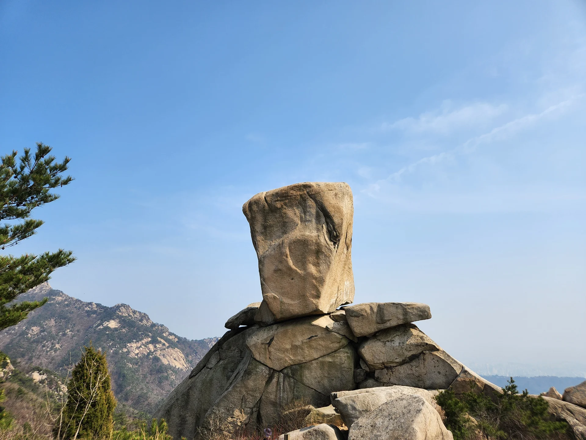 Set your phone against the majestic backdrop of Korea's mountain ranges. The Korean peninsula is nearly 70% mountainous, and these wallpapers celebrate that dramatic terrain — jagged granite peaks rising above the clouds, ancient fortress walls tracing ridgelines, and forest trails disappearing into autumn-colored valleys.

From the iconic rocky summits of Bukhansan in Seoul to the remote alpine meadows of Seoraksan, each image captures the scale and serenity of Korean mountain landscapes across all four seasons. Snow-dusted winter peaks, spring azalea blooms on hillsides, summer greenery, and fiery fall foliage are all here. Free download these aesthetic mountain wallpapers and carry Korea's highland grandeur in your pocket., Samobawi, Pyeongchang-dong, Seoul — Free Korean aesthetic wallpaper