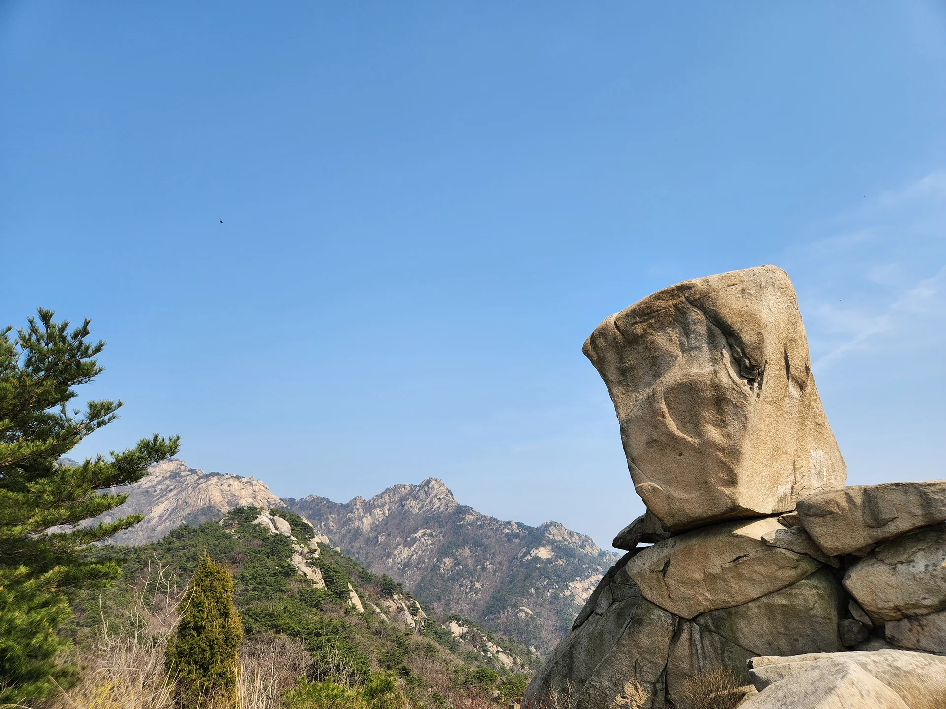 Set your phone against the majestic backdrop of Korea's mountain ranges. The Korean peninsula is nearly 70% mountainous, and these wallpapers celebrate that dramatic terrain — jagged granite peaks rising above the clouds, ancient fortress walls tracing ridgelines, and forest trails disappearing into autumn-colored valleys.

From the iconic rocky summits of Bukhansan in Seoul to the remote alpine meadows of Seoraksan, each image captures the scale and serenity of Korean mountain landscapes across all four seasons. Snow-dusted winter peaks, spring azalea blooms on hillsides, summer greenery, and fiery fall foliage are all here. Free download these aesthetic mountain wallpapers and carry Korea's highland grandeur in your pocket., Samobawi, Pyeongchang-dong, Seoul — Free Korean aesthetic wallpaper