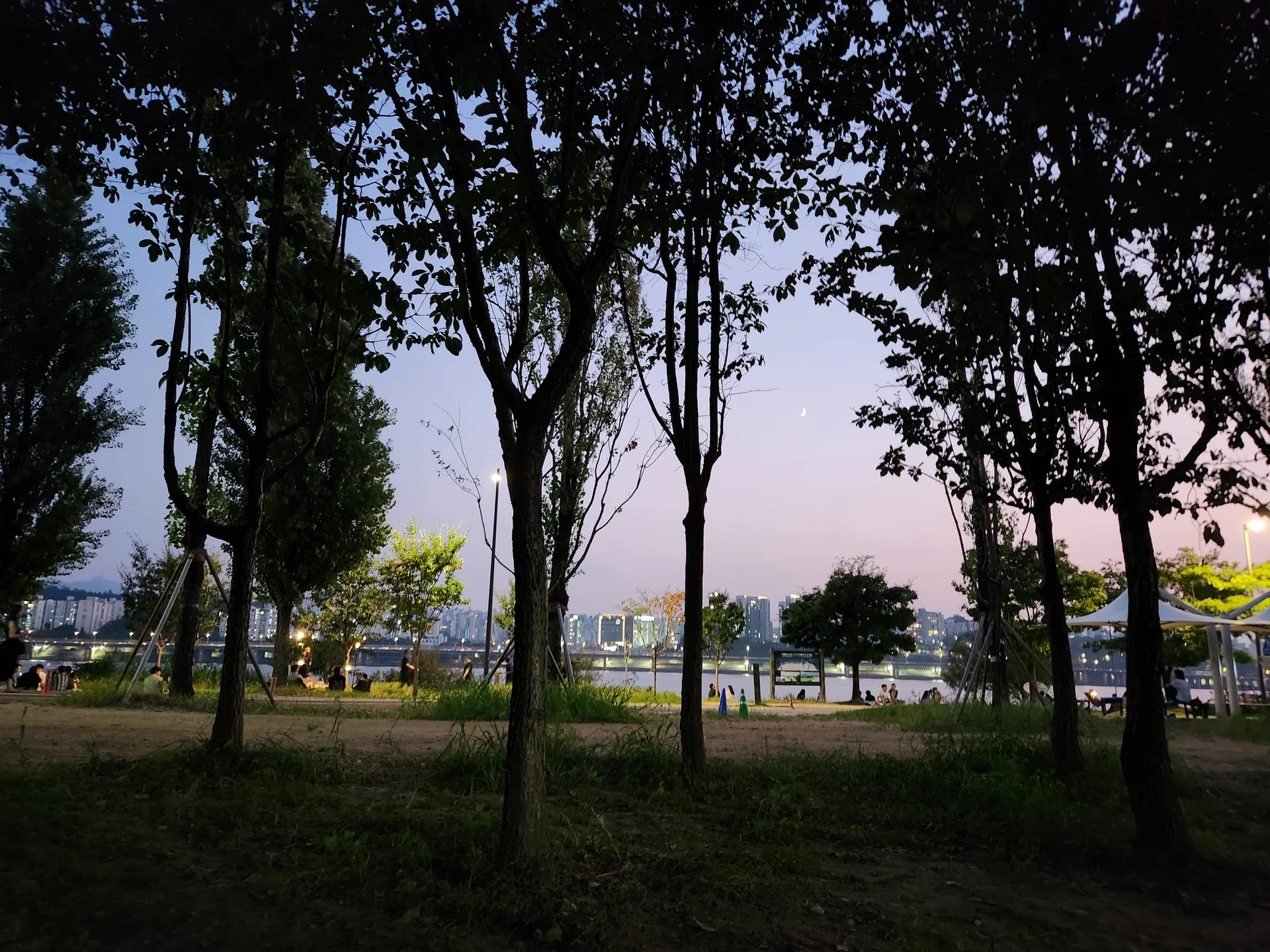 Immerse your screen in the untouched beauty of Korea's natural world. These Korean wallpapers feature sweeping countryside fields blanketed in green, hidden valleys where morning mist clings to the hillsides, and winding streams cutting through rocky terrain. Each photo captures the raw, peaceful energy that makes Korea's landscapes so distinctive.

From the volcanic plains of Jeju Island to the lush wetlands of Suncheon Bay, this collection showcases nature in every mood — dramatic storm clouds rolling over ridgelines, golden sunlight filtering through canopy gaps, and wildflower meadows stretching toward distant peaks. Download these aesthetic phone backgrounds for free and bring a moment of Korean tranquility to your daily life., 이촌나들목, Ichon 1(il)-dong, Seoul — Free Korean aesthetic wallpaper