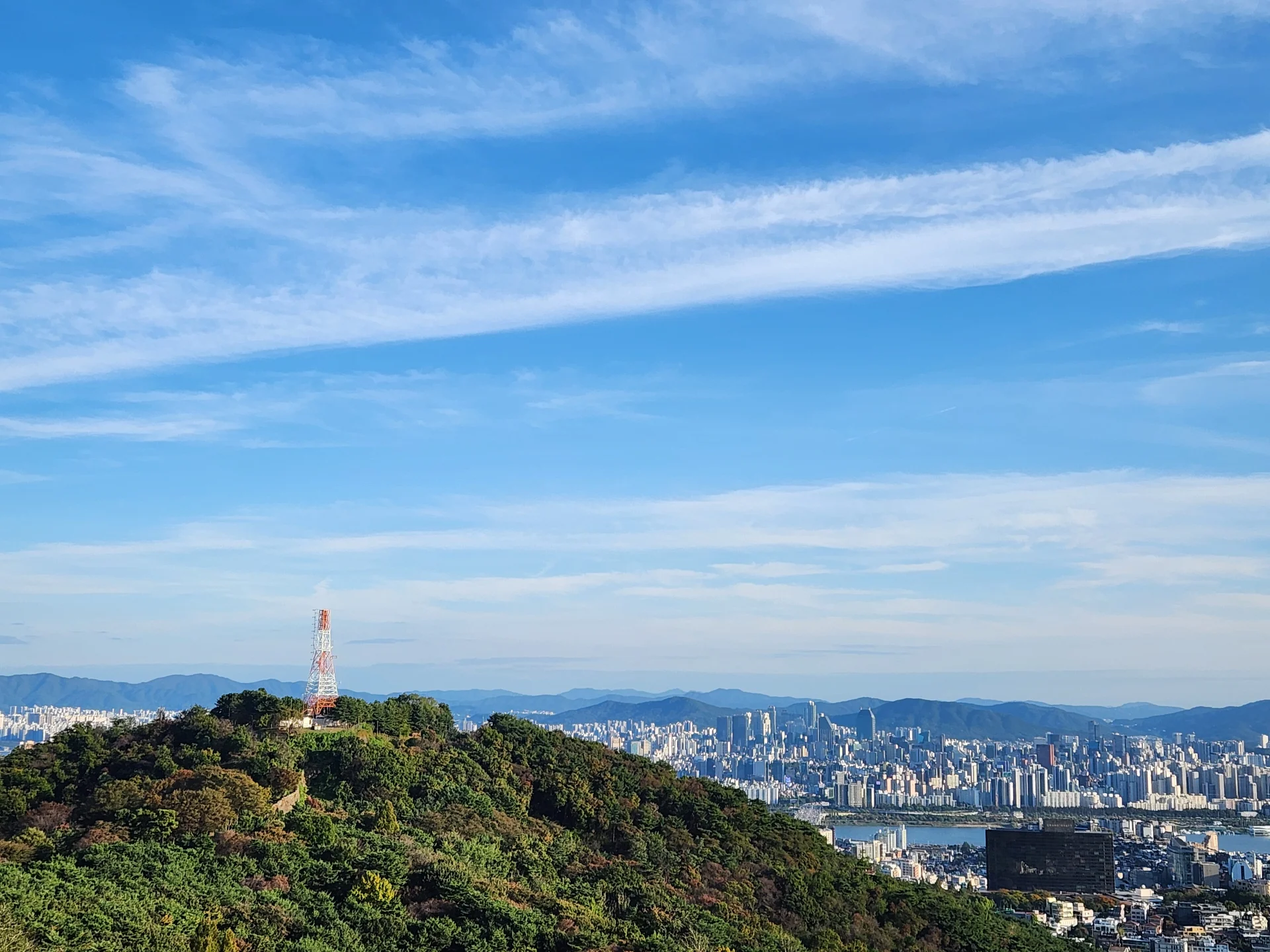 Immerse your screen in the untouched beauty of Korea's natural world. These Korean wallpapers feature sweeping countryside fields blanketed in green, hidden valleys where morning mist clings to the hillsides, and winding streams cutting through rocky terrain. Each photo captures the raw, peaceful energy that makes Korea's landscapes so distinctive.

From the volcanic plains of Jeju Island to the lush wetlands of Suncheon Bay, this collection showcases nature in every mood — dramatic storm clouds rolling over ridgelines, golden sunlight filtering through canopy gaps, and wildflower meadows stretching toward distant peaks. Download these aesthetic phone backgrounds for free and bring a moment of Korean tranquility to your daily life., Noksapyeong-daero, Yongsan 2(i)-ga-dong, Seoul — Free Korean aesthetic wallpaper