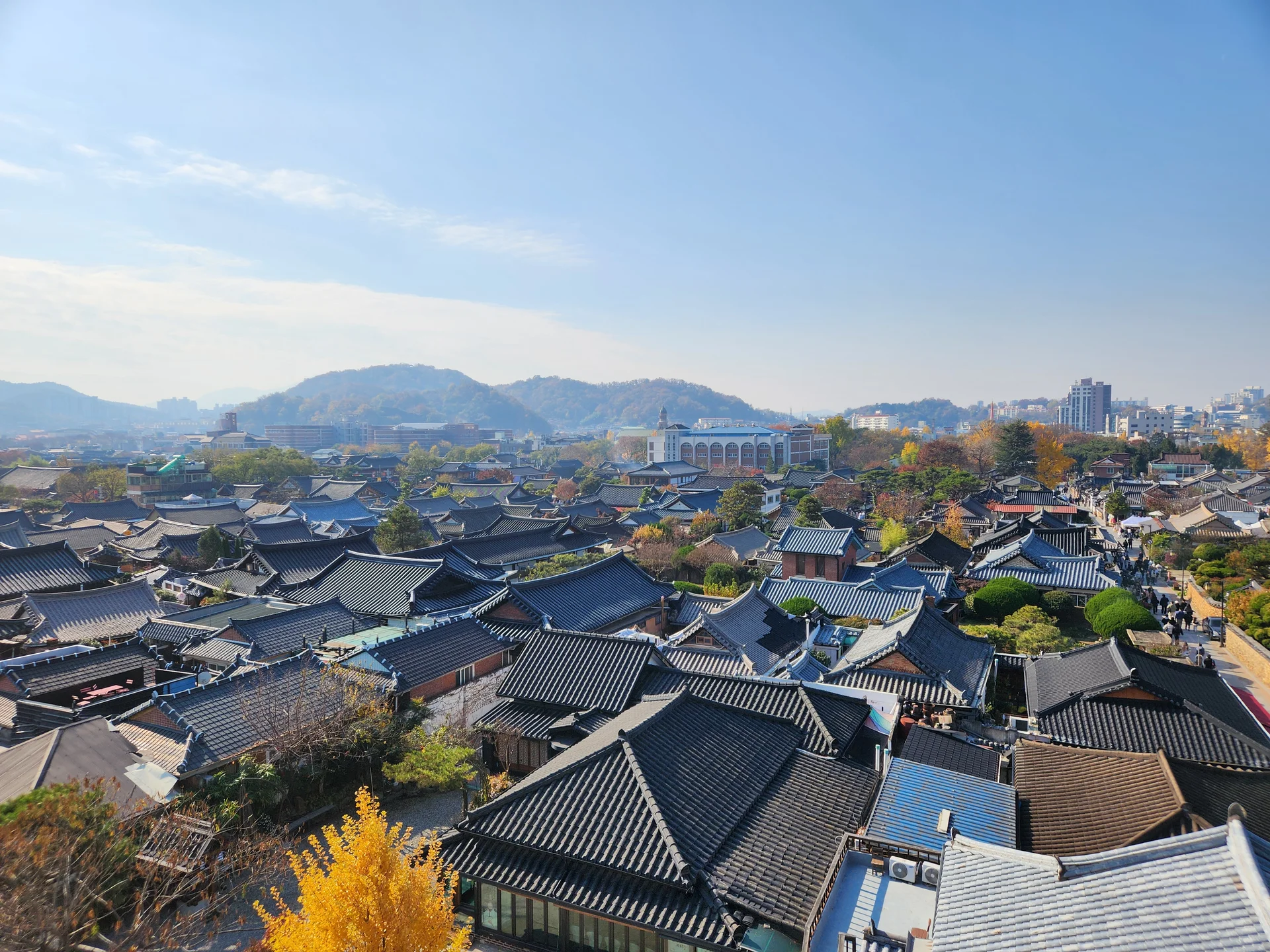 Explore Korea's architectural landscape through stunning phone wallpapers that span centuries of design. From the sleek glass curtain walls of Gangnam's skyscrapers to the raw concrete forms of brutalist apartment complexes, these images capture how Korea blends cutting-edge modernity with bold structural expression.

Look closer and you'll discover geometric patterns in subway station ceilings, sweeping curves of the Dongdaemun Design Plaza, and the quiet symmetry of traditional gate structures standing beside high-rises. Whether you're drawn to minimalist Korean design or dramatic urban geometry, these free aesthetic wallpapers transform your phone background into a gallery of architectural photography., Hanji-gil, Pungnam-dong 3-ga, Jeonju-si — Free Korean aesthetic wallpaper