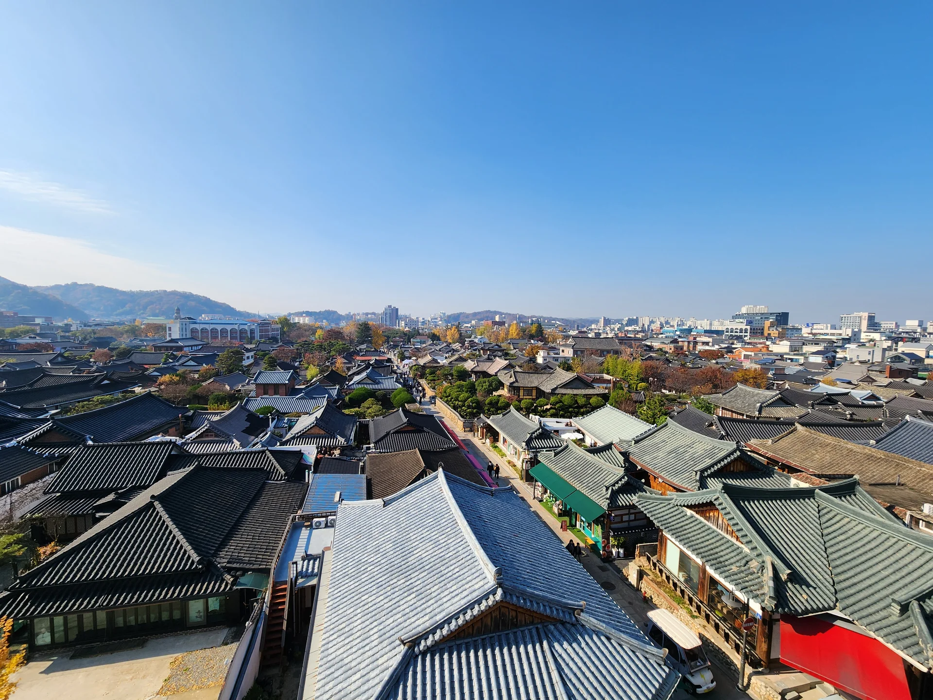 Explore Korea's architectural landscape through stunning phone wallpapers that span centuries of design. From the sleek glass curtain walls of Gangnam's skyscrapers to the raw concrete forms of brutalist apartment complexes, these images capture how Korea blends cutting-edge modernity with bold structural expression.

Look closer and you'll discover geometric patterns in subway station ceilings, sweeping curves of the Dongdaemun Design Plaza, and the quiet symmetry of traditional gate structures standing beside high-rises. Whether you're drawn to minimalist Korean design or dramatic urban geometry, these free aesthetic wallpapers transform your phone background into a gallery of architectural photography., Hanji-gil, Pungnam-dong 3-ga, Jeonju-si — Free Korean aesthetic wallpaper