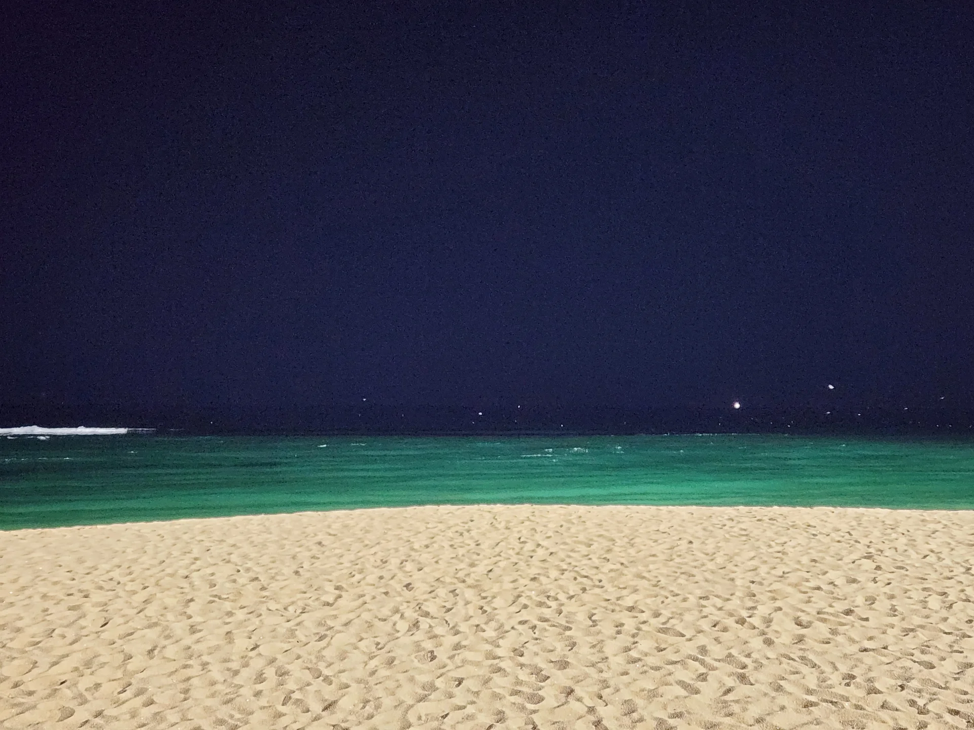 Bring the Korean coastline to your phone with these breathtaking ocean wallpapers. Korea is surrounded by water on three sides, and this collection captures it all — the turquoise shallows of Jeju's beaches, dramatic basalt cliffs plunging into the East Sea, tranquil fishing harbors at dawn, and endless Pacific horizons glowing under golden light.

These photos feature crashing waves against volcanic rock formations, serene island silhouettes at sunset, lighthouse beacons cutting through coastal fog, and the mirror-still surface of sheltered bays reflecting cotton-candy skies. Download these free Korean sea wallpapers for an aesthetic phone background that carries the calm and power of the ocean wherever you go., Cheonghohaean-gil (Donghaean Bicycle Path), Cheongho-dong, Sokcho-si — Free Korean aesthetic wallpaper