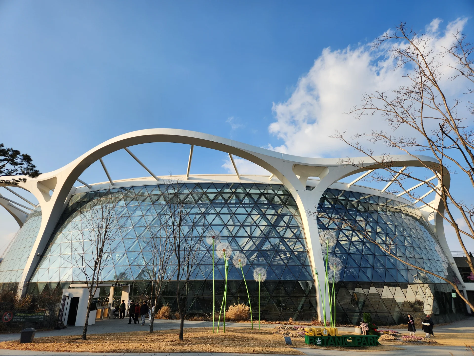 Explore Korea's architectural landscape through stunning phone wallpapers that span centuries of design. From the sleek glass curtain walls of Gangnam's skyscrapers to the raw concrete forms of brutalist apartment complexes, these images capture how Korea blends cutting-edge modernity with bold structural expression.

Look closer and you'll discover geometric patterns in subway station ceilings, sweeping curves of the Dongdaemun Design Plaza, and the quiet symmetry of traditional gate structures standing beside high-rises. Whether you're drawn to minimalist Korean design or dramatic urban geometry, these free aesthetic wallpapers transform your phone background into a gallery of architectural photography., Magokdong-ro, 마곡지구도시개발지구, Seoul — Free Korean aesthetic wallpaper