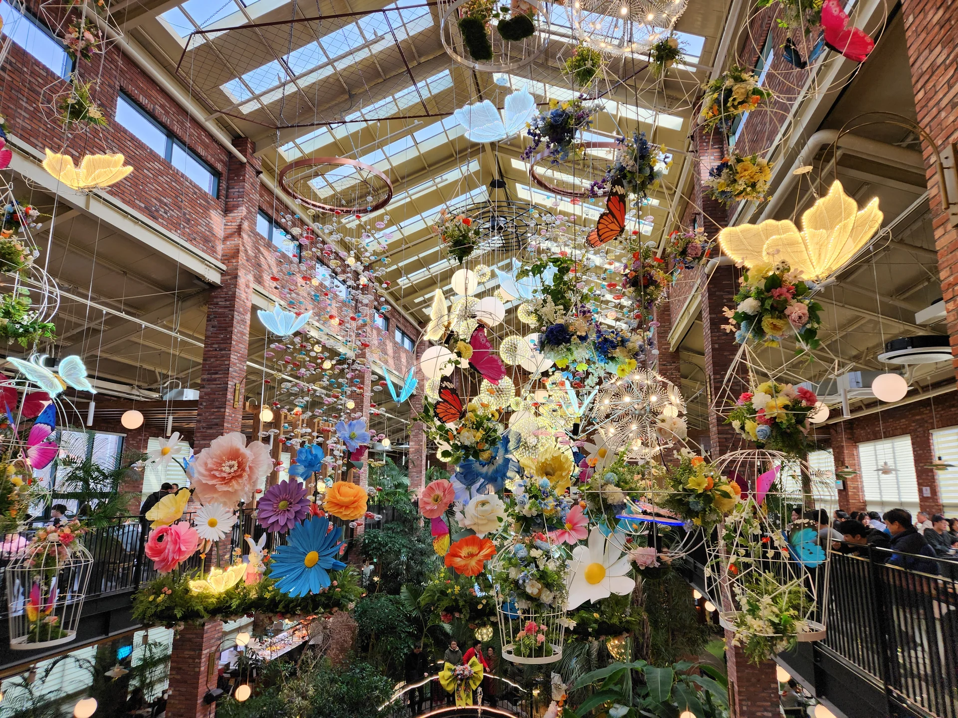 Wrap your phone in the cozy, Instagram-worthy atmosphere of Korean cafe culture. Korea's cafes are more than coffee shops — they're design experiences. These wallpapers feature warm interior light falling on minimalist wooden counters, perfectly crafted latte art in handmade ceramic cups, floor-to-ceiling windows overlooking quiet streets, and rooftop terraces with city panoramas.

From industrial-chic converted warehouses in Seongsu to tiny hidden basement cafes in Ikseon-dong, each image captures the aesthetic sensibility that makes Korean cafe design world-famous. Trailing plants, warm Edison bulbs, curated book walls, and the soft golden glow of afternoon light create scenes you'll want to stare at. Download these free Korean cafe wallpapers for a phone background that feels like a warm hug., Yeongsim-gil, Siksa-dong, Goyang-si — Free Korean aesthetic wallpaper