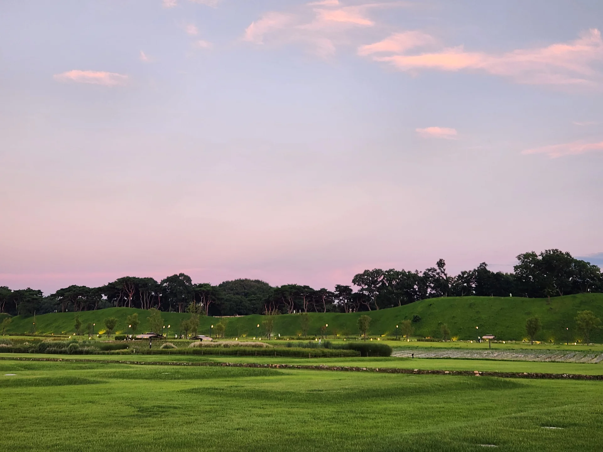 Explore Korea's architectural landscape through stunning phone wallpapers that span centuries of design. From the sleek glass curtain walls of Gangnam's skyscrapers to the raw concrete forms of brutalist apartment complexes, these images capture how Korea blends cutting-edge modernity with bold structural expression.

Look closer and you'll discover geometric patterns in subway station ceilings, sweeping curves of the Dongdaemun Design Plaza, and the quiet symmetry of traditional gate structures standing beside high-rises. Whether you're drawn to minimalist Korean design or dramatic urban geometry, these free aesthetic wallpapers transform your phone background into a gallery of architectural photography., Cheomseong-ro, Inwang-dong, Wolseong-dong, Gyeongju-si — Free Korean aesthetic wallpaper