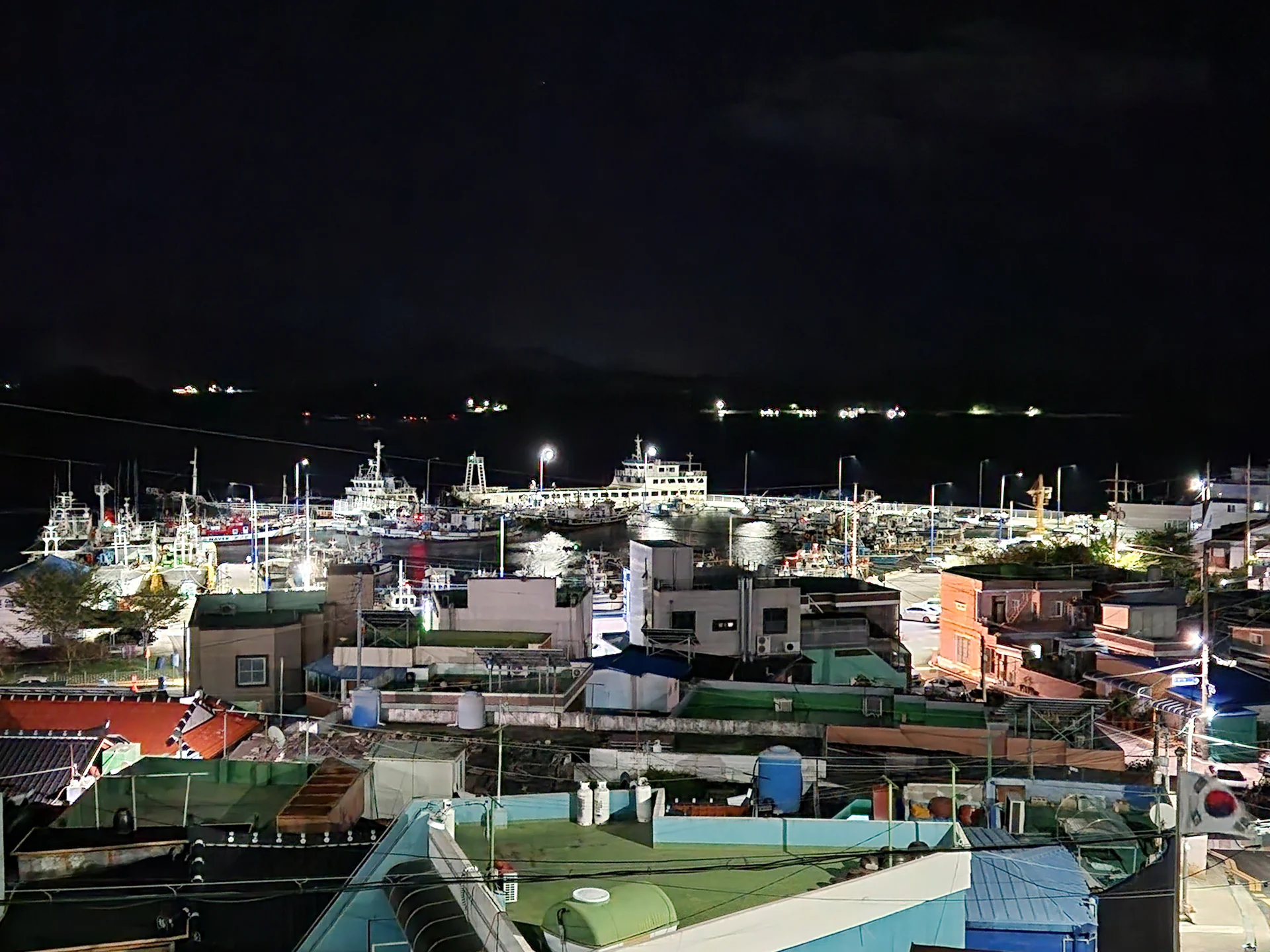 Light up your phone with the electric energy of Seoul after dark. These Korean nightscape wallpapers capture the city at its most cinematic — neon signage stacking up narrow alleyways, glowing street food stalls sending steam into cold night air, illuminated bridges spanning the Han River, and the shimmering towers of Gangnam reflected in rain-wet streets.

Seoul's nighttime personality is bold, colorful, and endlessly photogenic. You'll find the moody glow of Itaewon bars, the cyberpunk atmosphere of Euljiro's industrial blocks, and panoramic cityscapes from hilltop viewpoints where the city stretches to the horizon in every direction. Free download these aesthetic Seoul night wallpapers for a phone background that pulses with urban energy., Sinwol-ro, Sinwol-dong, Yeosu-si — Free Korean aesthetic wallpaper