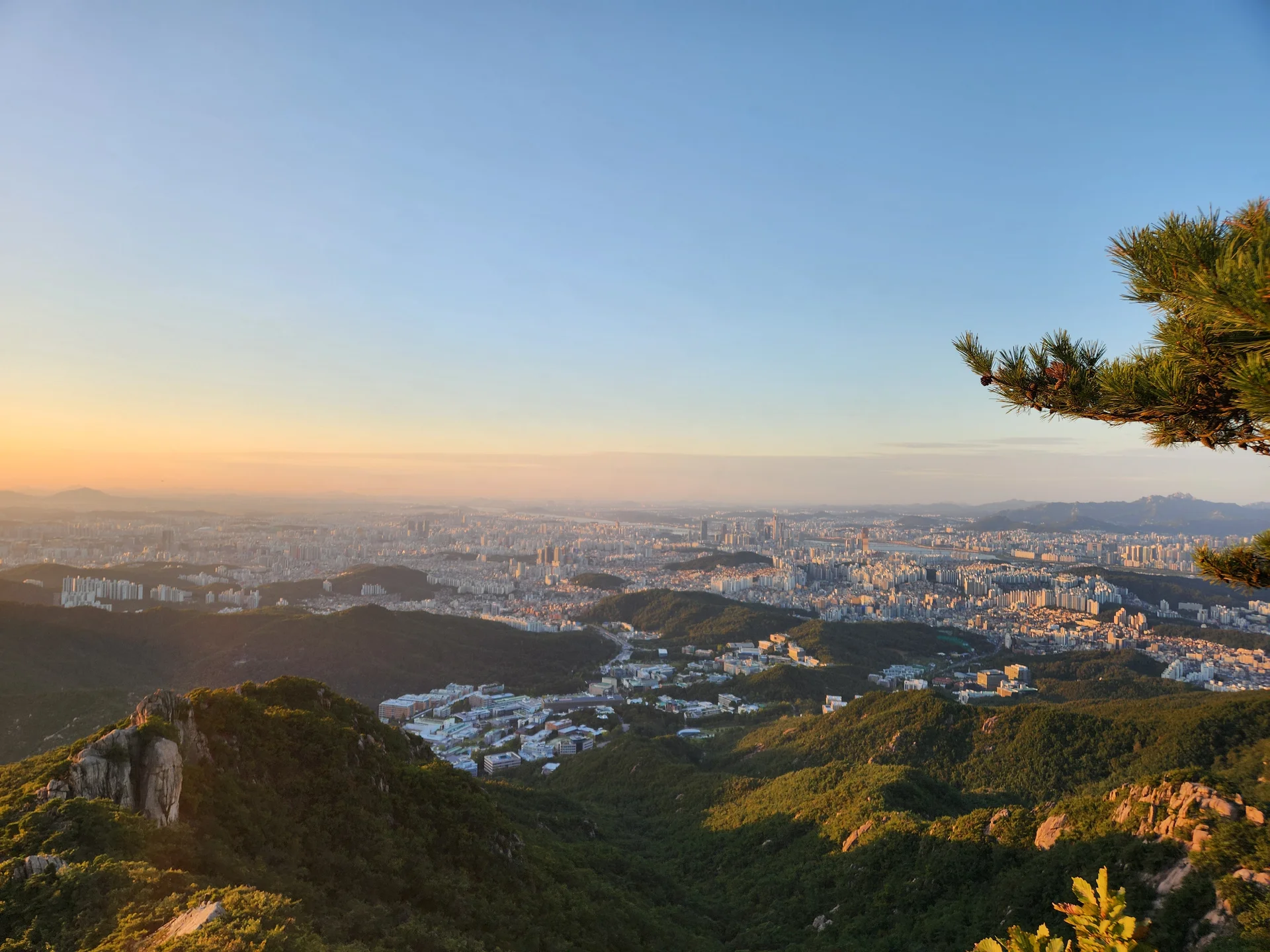 Immerse your screen in the untouched beauty of Korea's natural world. These Korean wallpapers feature sweeping countryside fields blanketed in green, hidden valleys where morning mist clings to the hillsides, and winding streams cutting through rocky terrain. Each photo captures the raw, peaceful energy that makes Korea's landscapes so distinctive.

From the volcanic plains of Jeju Island to the lush wetlands of Suncheon Bay, this collection showcases nature in every mood — dramatic storm clouds rolling over ridgelines, golden sunlight filtering through canopy gaps, and wildflower meadows stretching toward distant peaks. Download these aesthetic phone backgrounds for free and bring a moment of Korean tranquility to your daily life., Daehak-dong, Seoul — Free Korean aesthetic wallpaper