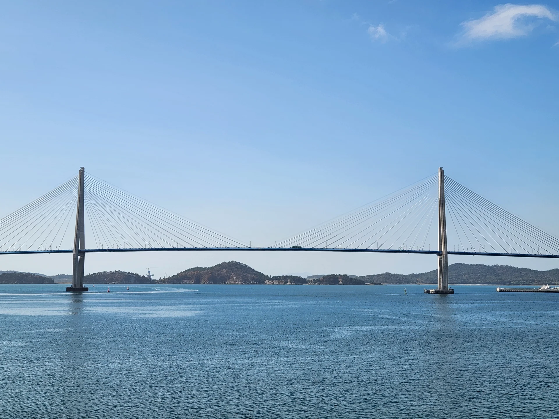 Bring the Korean coastline to your phone with these breathtaking ocean wallpapers. Korea is surrounded by water on three sides, and this collection captures it all — the turquoise shallows of Jeju's beaches, dramatic basalt cliffs plunging into the East Sea, tranquil fishing harbors at dawn, and endless Pacific horizons glowing under golden light.

These photos feature crashing waves against volcanic rock formations, serene island silhouettes at sunset, lighthouse beacons cutting through coastal fog, and the mirror-still surface of sheltered bays reflecting cotton-candy skies. Download these free Korean sea wallpapers for an aesthetic phone background that carries the calm and power of the ocean wherever you go., Mokpo-si, Jeollanam-do — Free Korean aesthetic wallpaper