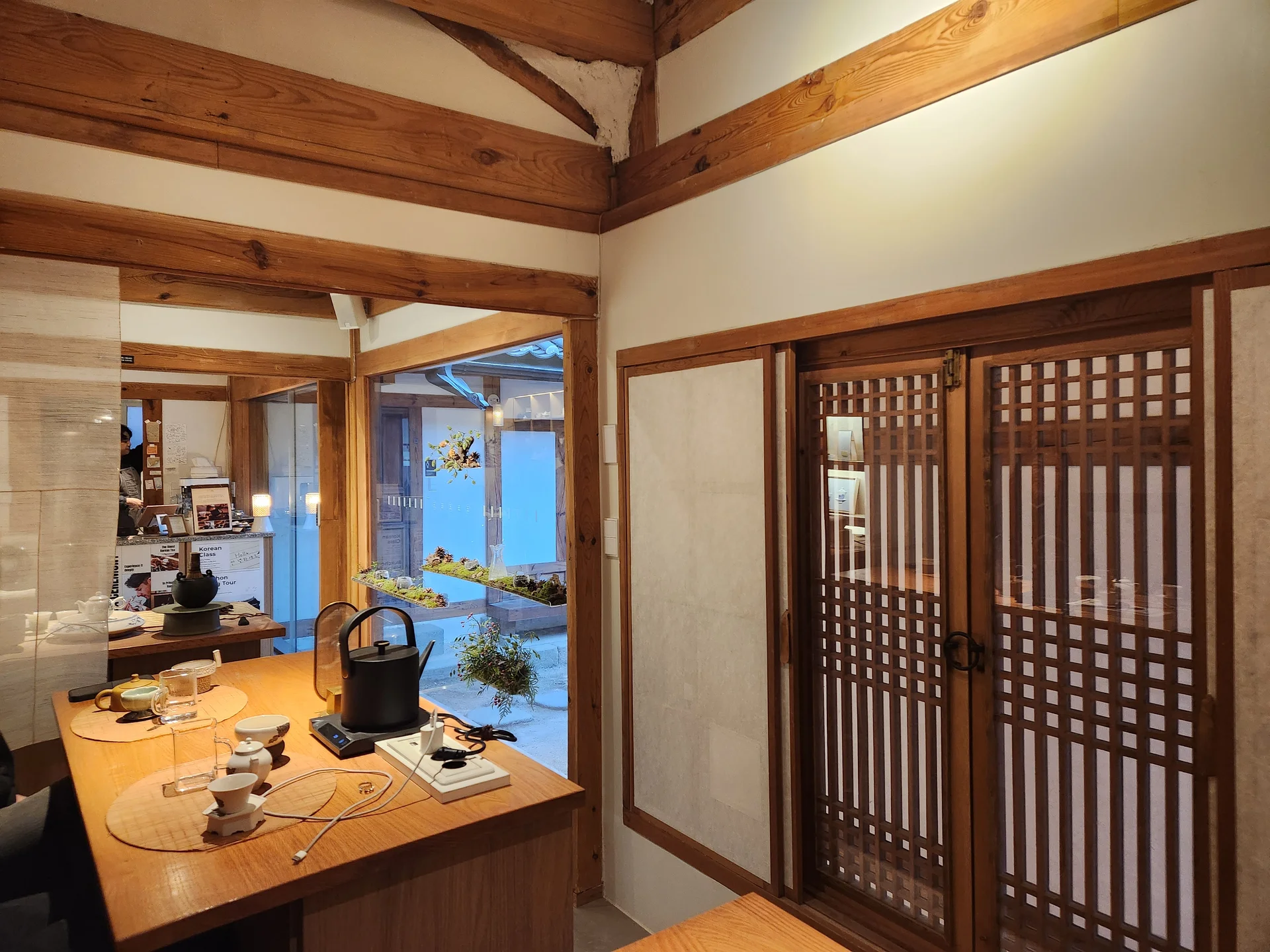 Adorn your phone with the timeless elegance of hanok, Korea's traditional wooden houses. These wallpapers showcase the graceful curved rooflines, hand-carved wooden lattice doors, and serene inner courtyards that have defined Korean residential architecture for centuries. Preserved hanok villages in Bukchon and Jeonju offer a living window into Korea's past.

Each image reveals the quiet beauty of these heritage homes — clay walls weathered to warm earth tones, dark timber frames contrasting with paper-screened windows, stone foundations meeting manicured courtyard gardens, and traditional eaves silhouetted against modern skylines. Download these free hanok wallpapers for an aesthetic phone background that celebrates the harmony between Korean tradition and contemporary life., Gyedong-gil, Gahoe-dong, Seoul — Free Korean aesthetic wallpaper