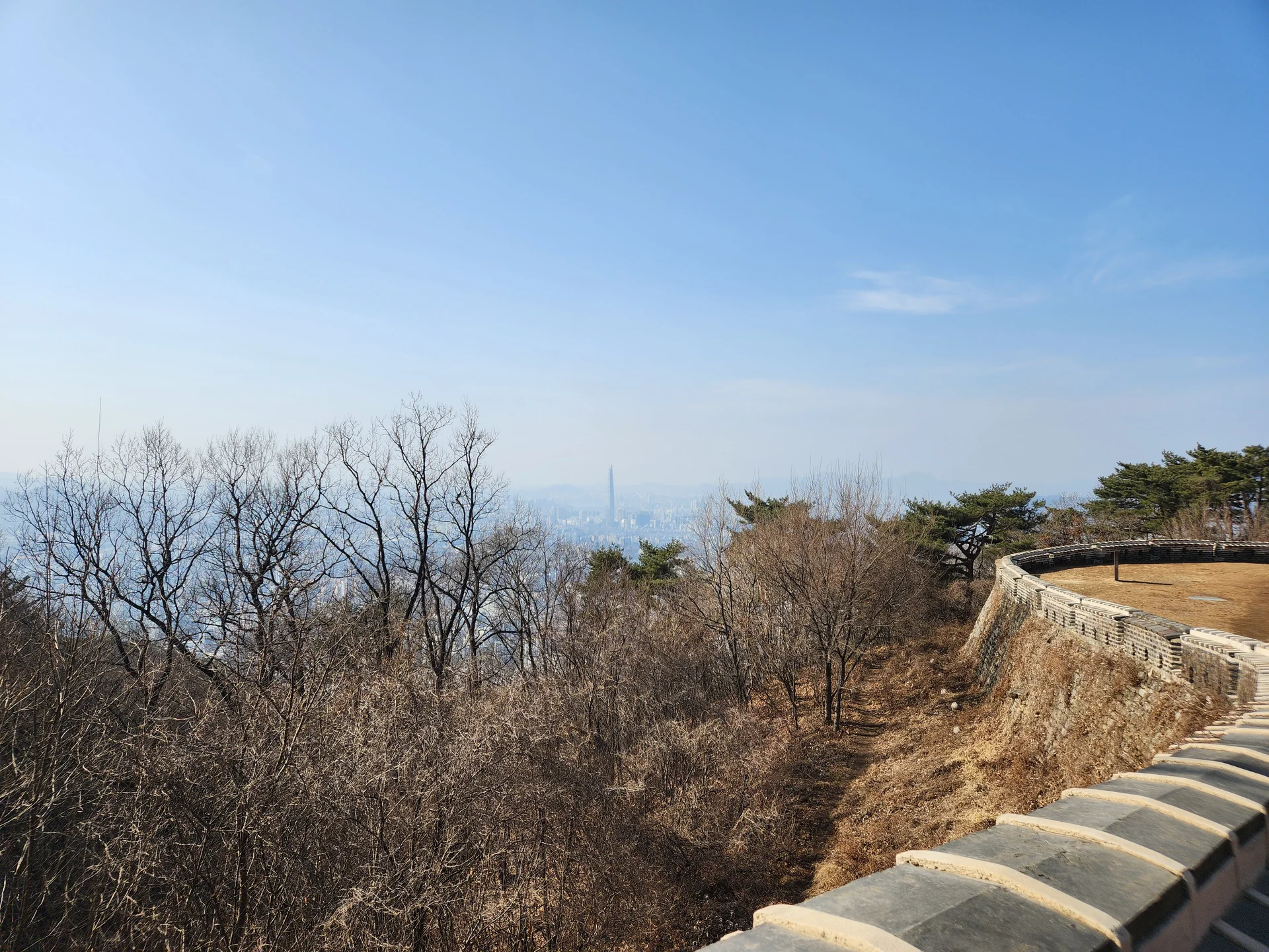 Explore Korea's architectural landscape through stunning phone wallpapers that span centuries of design. From the sleek glass curtain walls of Gangnam's skyscrapers to the raw concrete forms of brutalist apartment complexes, these images capture how Korea blends cutting-edge modernity with bold structural expression.

Look closer and you'll discover geometric patterns in subway station ceilings, sweeping curves of the Dongdaemun Design Plaza, and the quiet symmetry of traditional gate structures standing beside high-rises. Whether you're drawn to minimalist Korean design or dramatic urban geometry, these free aesthetic wallpapers transform your phone background into a gallery of architectural photography., Gwangju-si — Free Korean aesthetic wallpaper