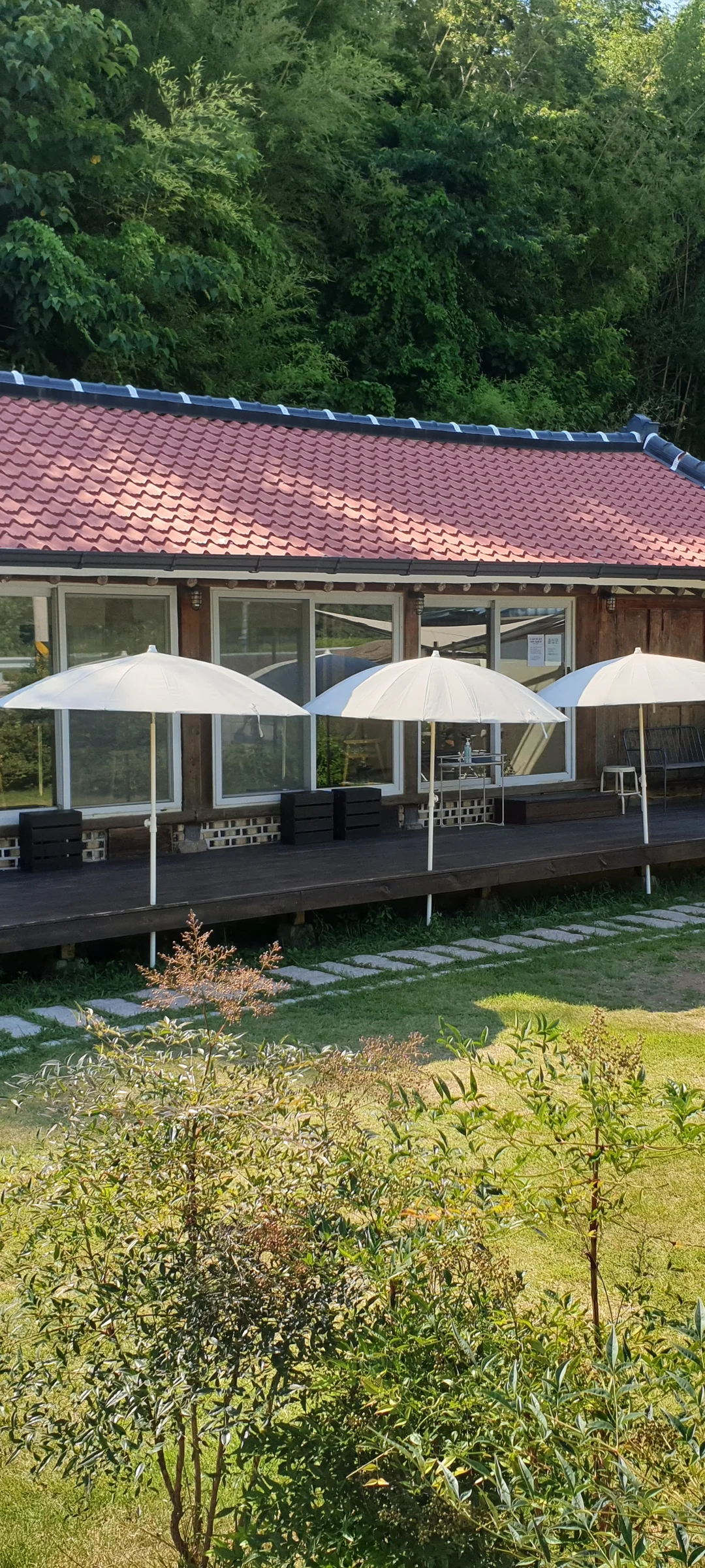 Wrap your phone in the cozy, Instagram-worthy atmosphere of Korean cafe culture. Korea's cafes are more than coffee shops — they're design experiences. These wallpapers feature warm interior light falling on minimalist wooden counters, perfectly crafted latte art in handmade ceramic cups, floor-to-ceiling windows overlooking quiet streets, and rooftop terraces with city panoramas.

From industrial-chic converted warehouses in Seongsu to tiny hidden basement cafes in Ikseon-dong, each image captures the aesthetic sensibility that makes Korean cafe design world-famous. Trailing plants, warm Edison bulbs, curated book walls, and the soft golden glow of afternoon light create scenes you'll want to stare at. Download these free Korean cafe wallpapers for a phone background that feels like a warm hug., Korean countryside — Free Korean aesthetic wallpaper