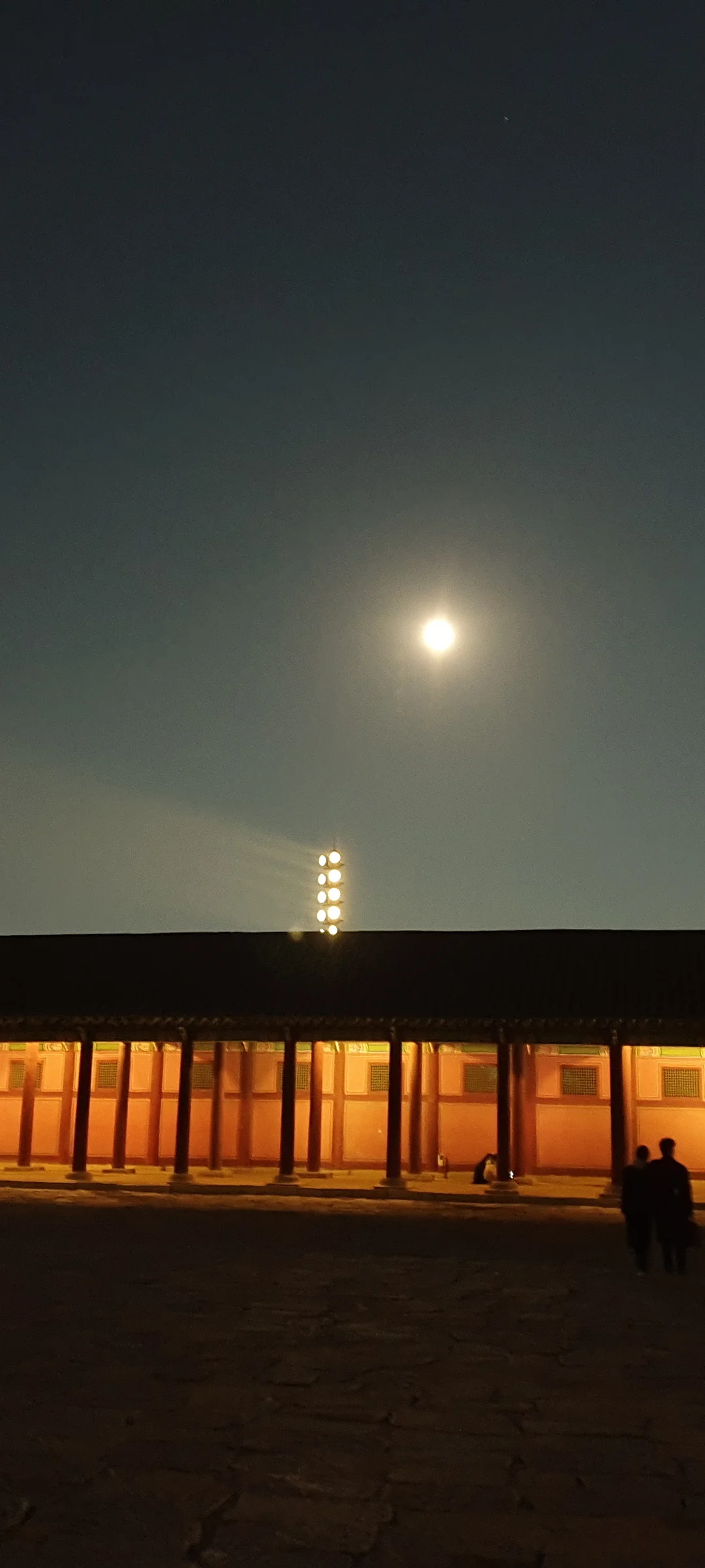 Light up your phone with the electric energy of Seoul after dark. These Korean nightscape wallpapers capture the city at its most cinematic — neon signage stacking up narrow alleyways, glowing street food stalls sending steam into cold night air, illuminated bridges spanning the Han River, and the shimmering towers of Gangnam reflected in rain-wet streets.

Seoul's nighttime personality is bold, colorful, and endlessly photogenic. You'll find the moody glow of Itaewon bars, the cyberpunk atmosphere of Euljiro's industrial blocks, and panoramic cityscapes from hilltop viewpoints where the city stretches to the horizon in every direction. Free download these aesthetic Seoul night wallpapers for a phone background that pulses with urban energy., Seoul, Gyeongbokgung Palace — Free Korean aesthetic wallpaper