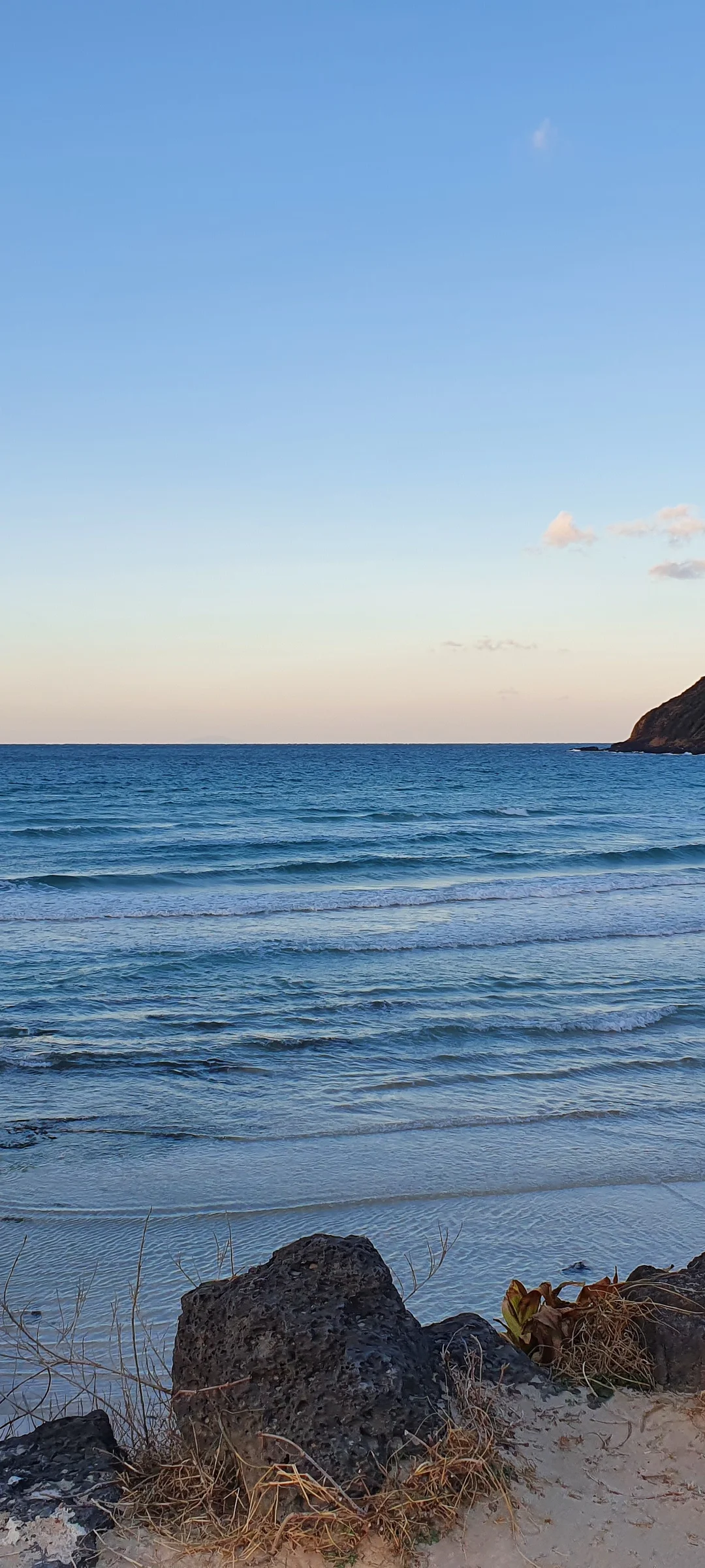 Bring the Korean coastline to your phone with these breathtaking ocean wallpapers. Korea is surrounded by water on three sides, and this collection captures it all — the turquoise shallows of Jeju's beaches, dramatic basalt cliffs plunging into the East Sea, tranquil fishing harbors at dawn, and endless Pacific horizons glowing under golden light.

These photos feature crashing waves against volcanic rock formations, serene island silhouettes at sunset, lighthouse beacons cutting through coastal fog, and the mirror-still surface of sheltered bays reflecting cotton-candy skies. Download these free Korean sea wallpapers for an aesthetic phone background that carries the calm and power of the ocean wherever you go., Jeju Island — Free Korean aesthetic wallpaper