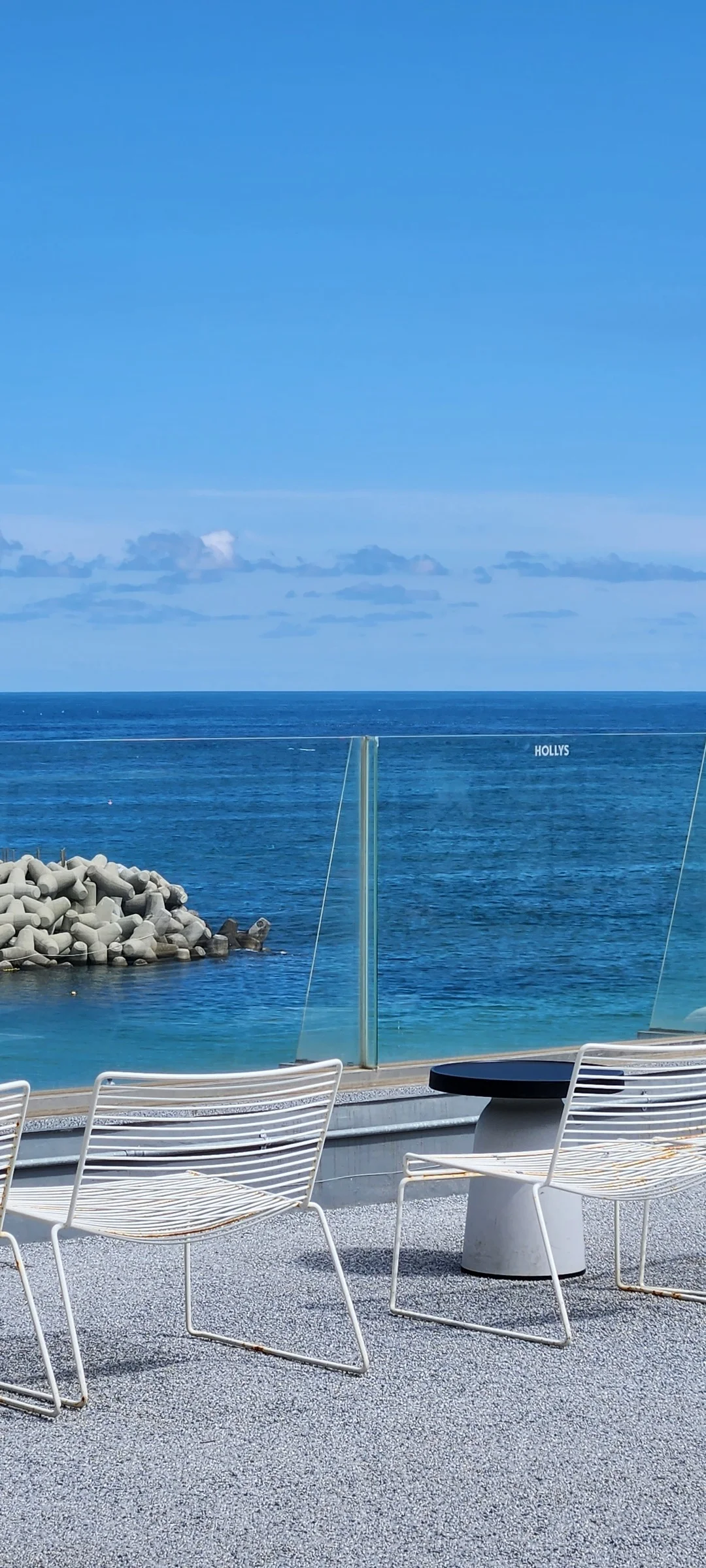 Wrap your phone in the cozy, Instagram-worthy atmosphere of Korean cafe culture. Korea's cafes are more than coffee shops — they're design experiences. These wallpapers feature warm interior light falling on minimalist wooden counters, perfectly crafted latte art in handmade ceramic cups, floor-to-ceiling windows overlooking quiet streets, and rooftop terraces with city panoramas.

From industrial-chic converted warehouses in Seongsu to tiny hidden basement cafes in Ikseon-dong, each image captures the aesthetic sensibility that makes Korean cafe design world-famous. Trailing plants, warm Edison bulbs, curated book walls, and the soft golden glow of afternoon light create scenes you'll want to stare at. Download these free Korean cafe wallpapers for a phone background that feels like a warm hug., 영랑해안길, Yeongnang-dong, Sokcho-si — Free Korean aesthetic wallpaper