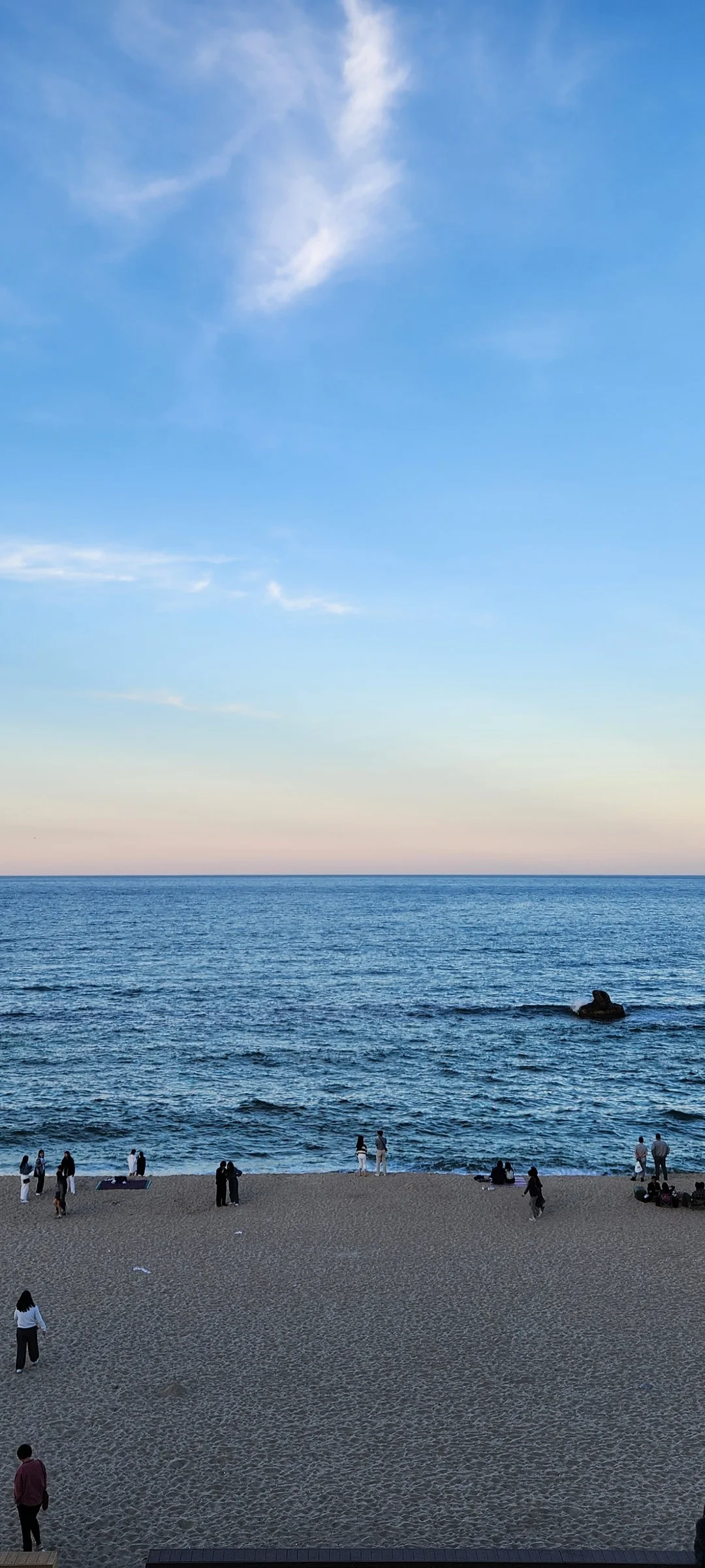 Bring the Korean coastline to your phone with these breathtaking ocean wallpapers. Korea is surrounded by water on three sides, and this collection captures it all — the turquoise shallows of Jeju's beaches, dramatic basalt cliffs plunging into the East Sea, tranquil fishing harbors at dawn, and endless Pacific horizons glowing under golden light.

These photos feature crashing waves against volcanic rock formations, serene island silhouettes at sunset, lighthouse beacons cutting through coastal fog, and the mirror-still surface of sheltered bays reflecting cotton-candy skies. Download these free Korean sea wallpapers for an aesthetic phone background that carries the calm and power of the ocean wherever you go., Changhae-ro 14beon-gil, 송정동, Gangneung-si — Free Korean aesthetic wallpaper