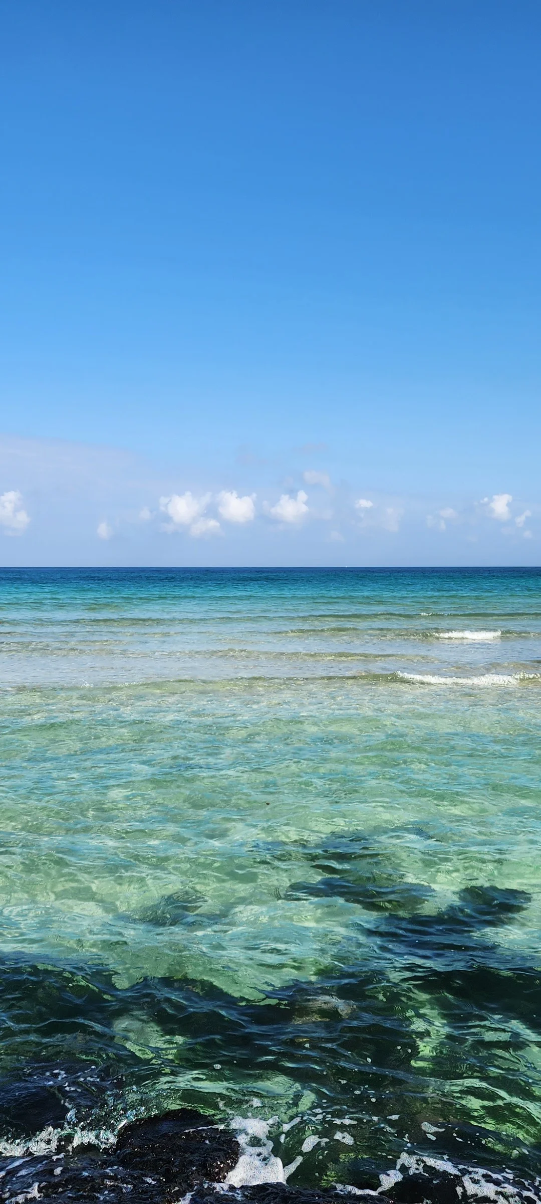 Bring the Korean coastline to your phone with these breathtaking ocean wallpapers. Korea is surrounded by water on three sides, and this collection captures it all — the turquoise shallows of Jeju's beaches, dramatic basalt cliffs plunging into the East Sea, tranquil fishing harbors at dawn, and endless Pacific horizons glowing under golden light.

These photos feature crashing waves against volcanic rock formations, serene island silhouettes at sunset, lighthouse beacons cutting through coastal fog, and the mirror-still surface of sheltered bays reflecting cotton-candy skies. Download these free Korean sea wallpapers for an aesthetic phone background that carries the calm and power of the ocean wherever you go., Haemajihaean-ro, Jeju — Free Korean aesthetic wallpaper