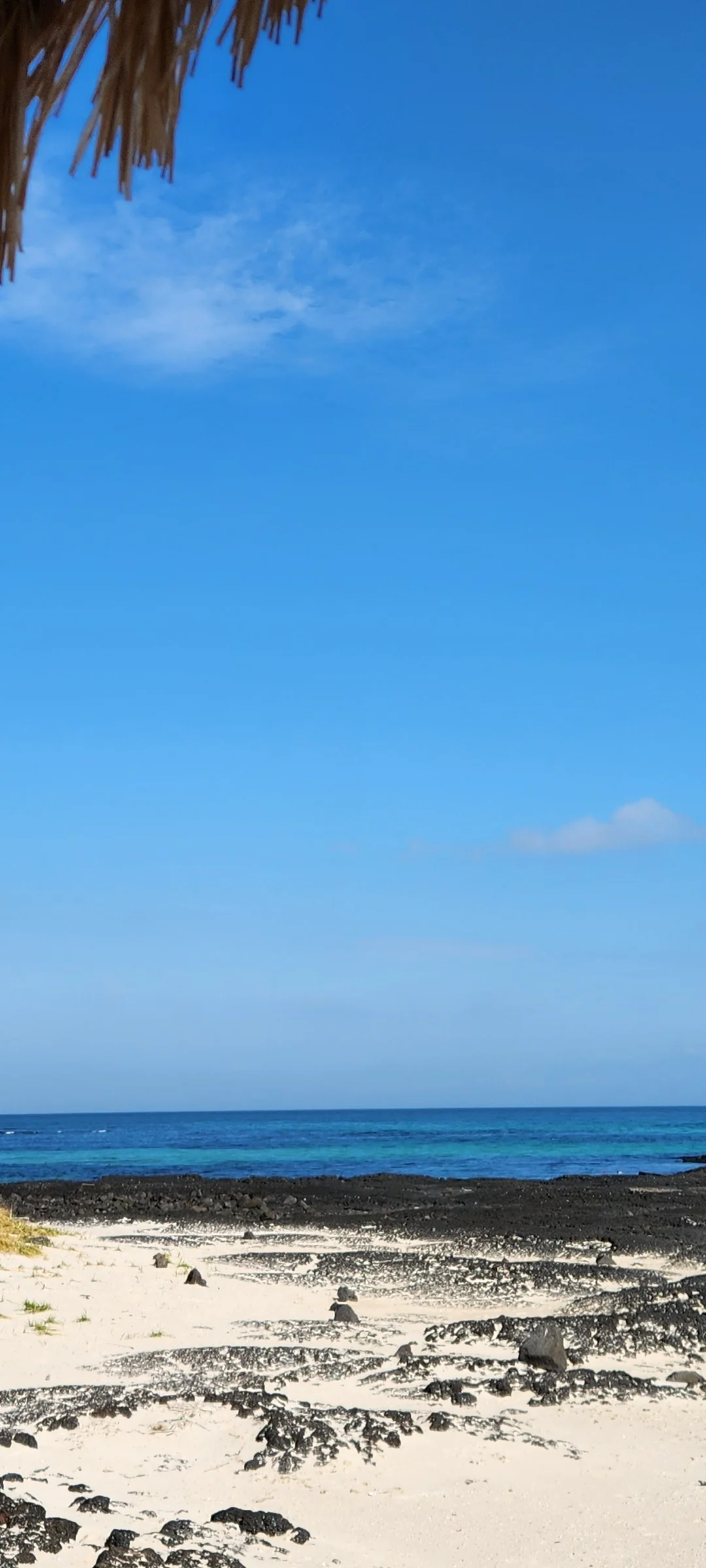 Bring the Korean coastline to your phone with these breathtaking ocean wallpapers. Korea is surrounded by water on three sides, and this collection captures it all — the turquoise shallows of Jeju's beaches, dramatic basalt cliffs plunging into the East Sea, tranquil fishing harbors at dawn, and endless Pacific horizons glowing under golden light.

These photos feature crashing waves against volcanic rock formations, serene island silhouettes at sunset, lighthouse beacons cutting through coastal fog, and the mirror-still surface of sheltered bays reflecting cotton-candy skies. Download these free Korean sea wallpapers for an aesthetic phone background that carries the calm and power of the ocean wherever you go., Haemajihaean-ro, Jeju — Free Korean aesthetic wallpaper