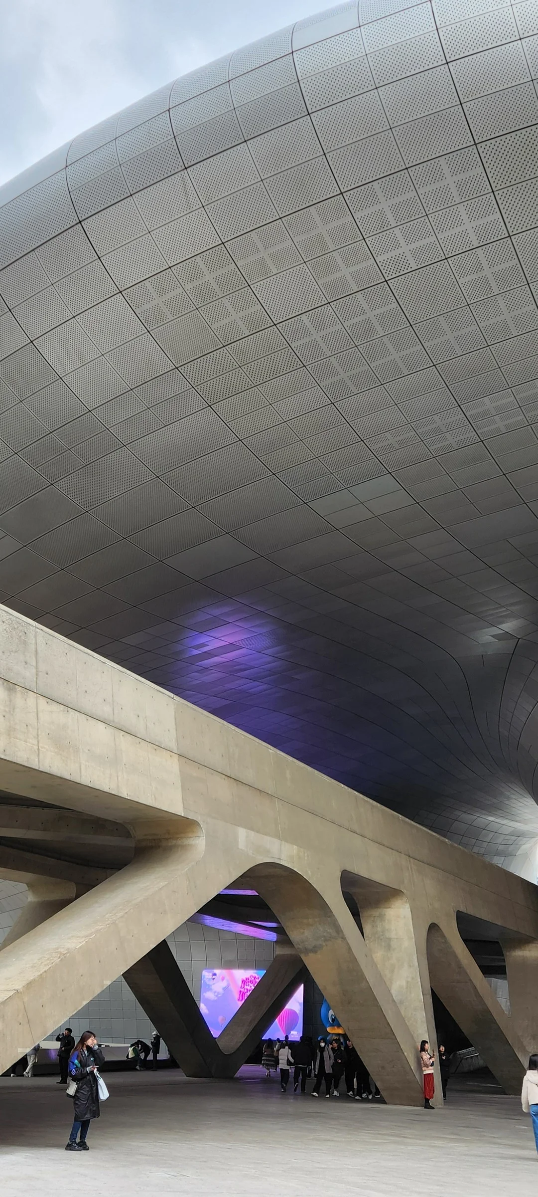 Explore Korea's architectural landscape through stunning phone wallpapers that span centuries of design. From the sleek glass curtain walls of Gangnam's skyscrapers to the raw concrete forms of brutalist apartment complexes, these images capture how Korea blends cutting-edge modernity with bold structural expression.

Look closer and you'll discover geometric patterns in subway station ceilings, sweeping curves of the Dongdaemun Design Plaza, and the quiet symmetry of traditional gate structures standing beside high-rises. Whether you're drawn to minimalist Korean design or dramatic urban geometry, these free aesthetic wallpapers transform your phone background into a gallery of architectural photography., Euljiro Underground Shopping Center, Gwanghui-dong, Seoul — Free Korean aesthetic wallpaper