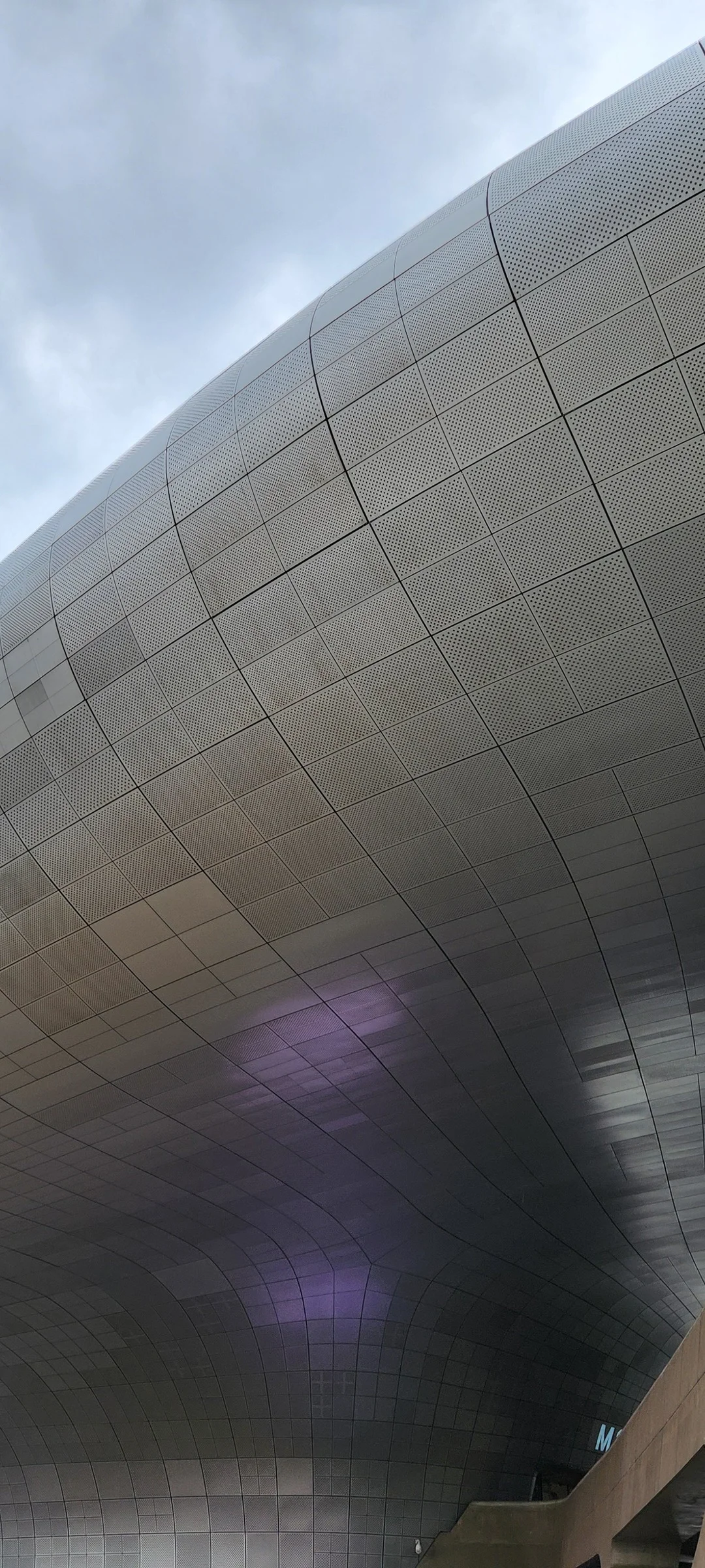 Explore Korea's architectural landscape through stunning phone wallpapers that span centuries of design. From the sleek glass curtain walls of Gangnam's skyscrapers to the raw concrete forms of brutalist apartment complexes, these images capture how Korea blends cutting-edge modernity with bold structural expression.

Look closer and you'll discover geometric patterns in subway station ceilings, sweeping curves of the Dongdaemun Design Plaza, and the quiet symmetry of traditional gate structures standing beside high-rises. Whether you're drawn to minimalist Korean design or dramatic urban geometry, these free aesthetic wallpapers transform your phone background into a gallery of architectural photography., Euljiro Underground Shopping Center, Gwanghui-dong, Seoul — Free Korean aesthetic wallpaper