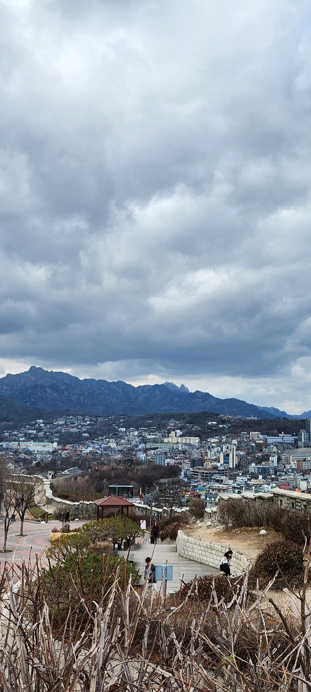 Immerse your screen in the untouched beauty of Korea's natural world. These Korean wallpapers feature sweeping countryside fields blanketed in green, hidden valleys where morning mist clings to the hillsides, and winding streams cutting through rocky terrain. Each photo captures the raw, peaceful energy that makes Korea's landscapes so distinctive.

From the volcanic plains of Jeju Island to the lush wetlands of Suncheon Bay, this collection showcases nature in every mood — dramatic storm clouds rolling over ridgelines, golden sunlight filtering through canopy gaps, and wildflower meadows stretching toward distant peaks. Download these aesthetic phone backgrounds for free and bring a moment of Korean tranquility to your daily life., Naksan-gil, Ihwa-dong, Seoul — Free Korean aesthetic wallpaper