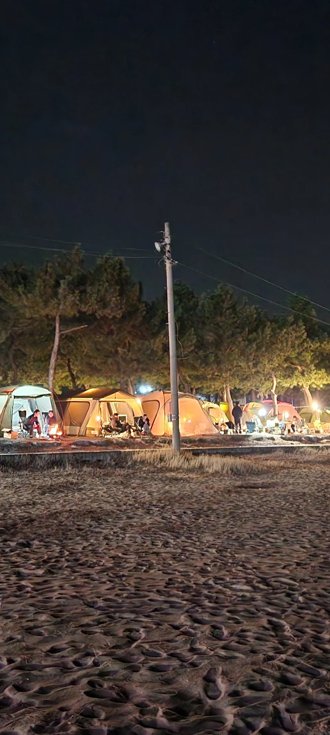 Light up your phone with the electric energy of Seoul after dark. These Korean nightscape wallpapers capture the city at its most cinematic — neon signage stacking up narrow alleyways, glowing street food stalls sending steam into cold night air, illuminated bridges spanning the Han River, and the shimmering towers of Gangnam reflected in rain-wet streets.

Seoul's nighttime personality is bold, colorful, and endlessly photogenic. You'll find the moody glow of Itaewon bars, the cyberpunk atmosphere of Euljiro's industrial blocks, and panoramic cityscapes from hilltop viewpoints where the city stretches to the horizon in every direction. Free download these aesthetic Seoul night wallpapers for a phone background that pulses with urban energy., Ingujungang-gil, Hyeonnam — Free Korean aesthetic wallpaper