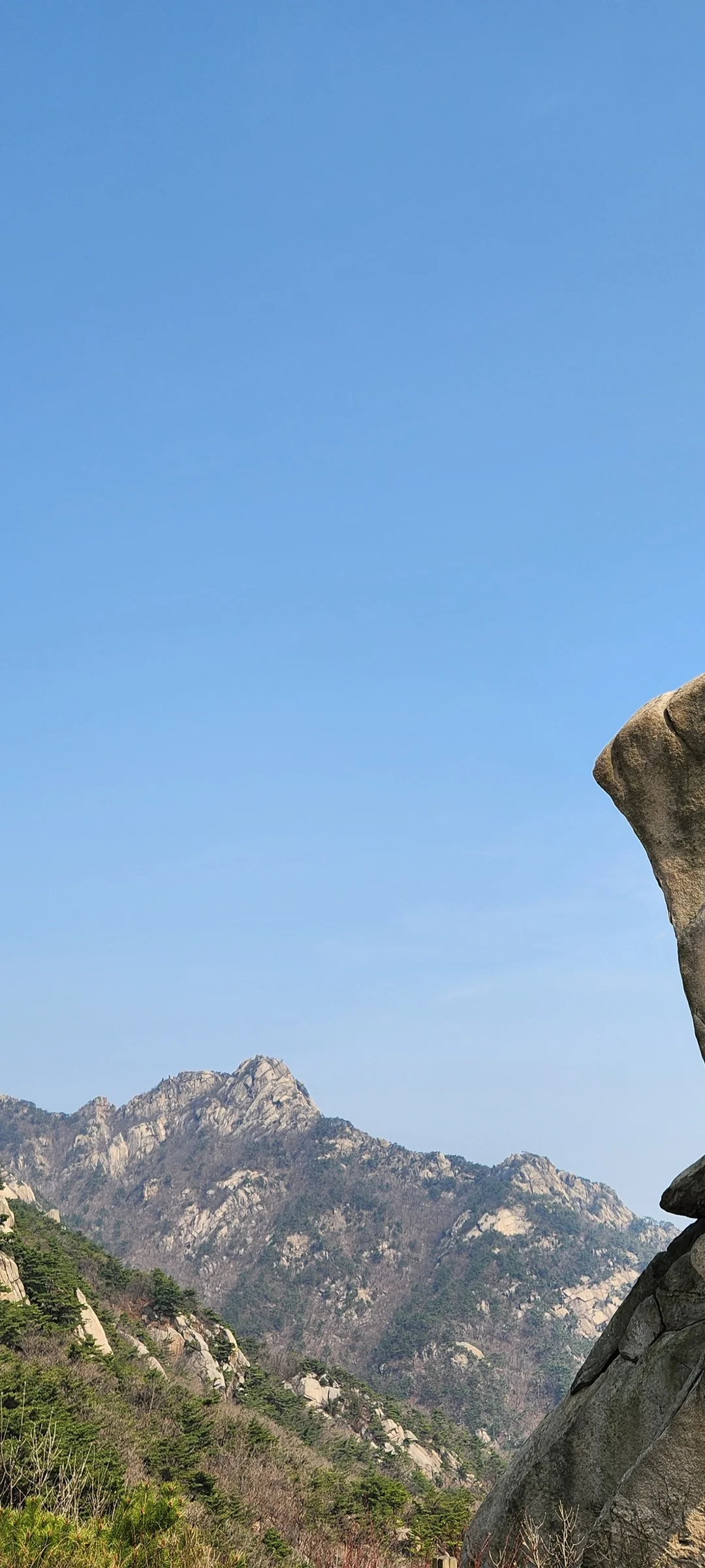 Set your phone against the majestic backdrop of Korea's mountain ranges. The Korean peninsula is nearly 70% mountainous, and these wallpapers celebrate that dramatic terrain — jagged granite peaks rising above the clouds, ancient fortress walls tracing ridgelines, and forest trails disappearing into autumn-colored valleys.

From the iconic rocky summits of Bukhansan in Seoul to the remote alpine meadows of Seoraksan, each image captures the scale and serenity of Korean mountain landscapes across all four seasons. Snow-dusted winter peaks, spring azalea blooms on hillsides, summer greenery, and fiery fall foliage are all here. Free download these aesthetic mountain wallpapers and carry Korea's highland grandeur in your pocket., Samobawi, Pyeongchang-dong, Seoul — Free Korean aesthetic wallpaper