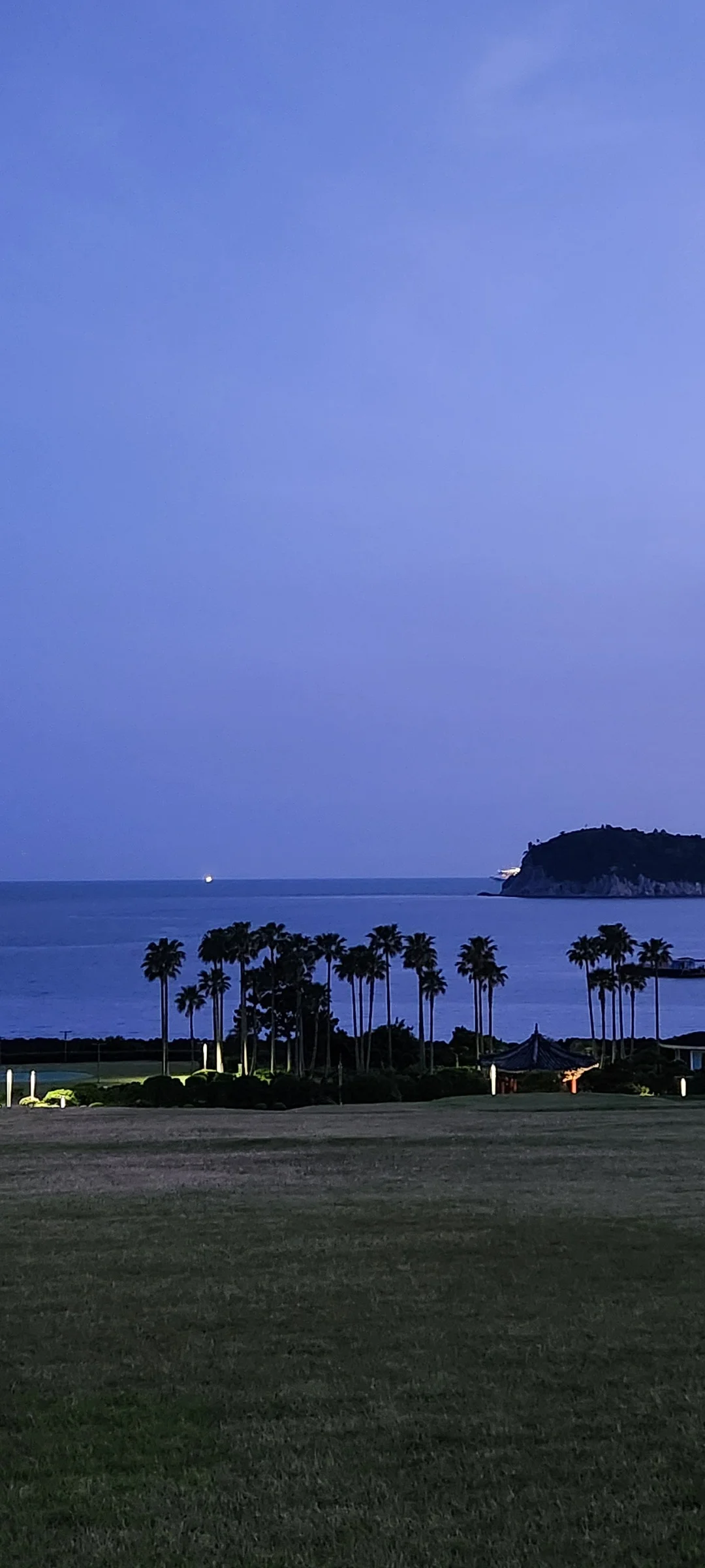 Immerse your screen in the untouched beauty of Korea's natural world. These Korean wallpapers feature sweeping countryside fields blanketed in green, hidden valleys where morning mist clings to the hillsides, and winding streams cutting through rocky terrain. Each photo captures the raw, peaceful energy that makes Korea's landscapes so distinctive.

From the volcanic plains of Jeju Island to the lush wetlands of Suncheon Bay, this collection showcases nature in every mood — dramatic storm clouds rolling over ridgelines, golden sunlight filtering through canopy gaps, and wildflower meadows stretching toward distant peaks. Download these aesthetic phone backgrounds for free and bring a moment of Korean tranquility to your daily life., Geomeunyeo-ro, Songsan-dong, Seogwipo-si — Free Korean aesthetic wallpaper