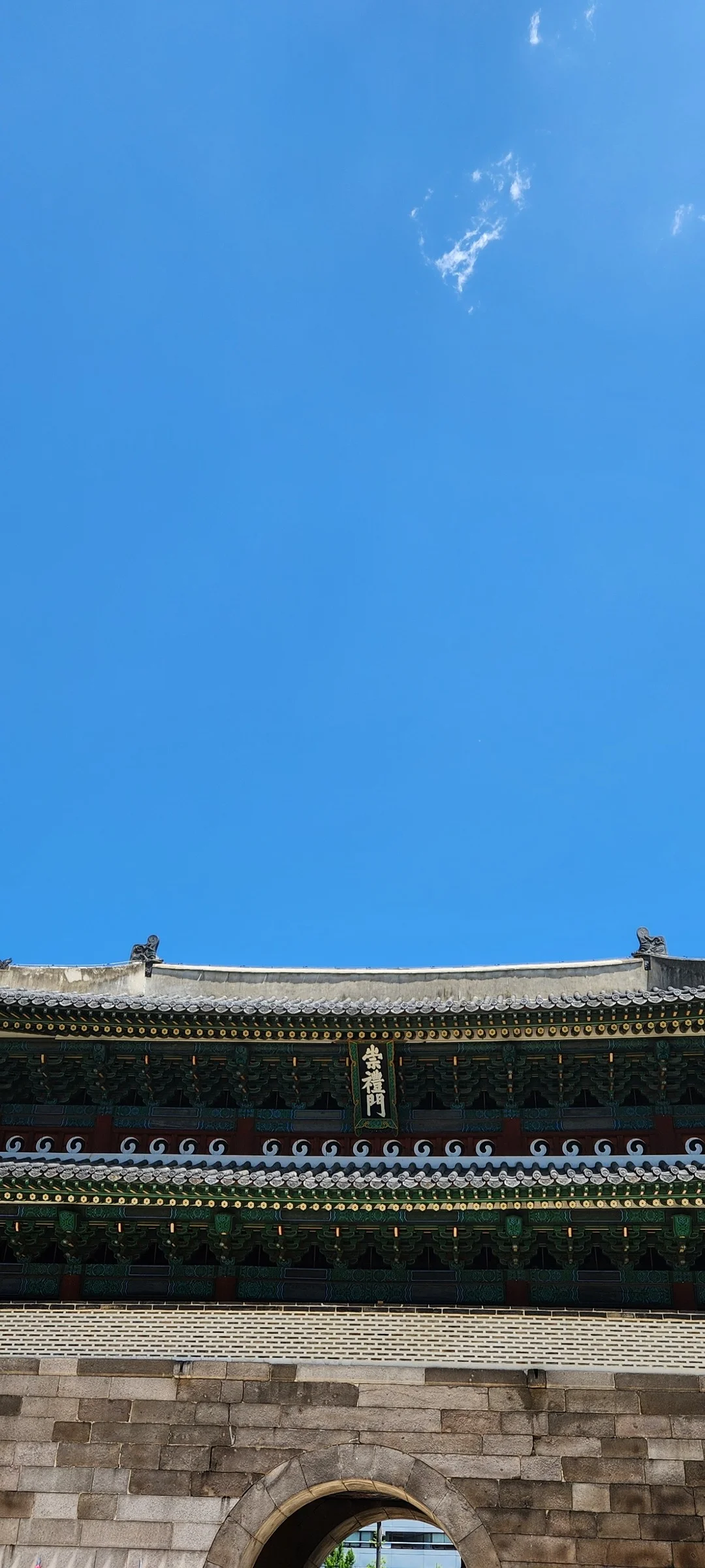 Explore Korea's architectural landscape through stunning phone wallpapers that span centuries of design. From the sleek glass curtain walls of Gangnam's skyscrapers to the raw concrete forms of brutalist apartment complexes, these images capture how Korea blends cutting-edge modernity with bold structural expression.

Look closer and you'll discover geometric patterns in subway station ceilings, sweeping curves of the Dongdaemun Design Plaza, and the quiet symmetry of traditional gate structures standing beside high-rises. Whether you're drawn to minimalist Korean design or dramatic urban geometry, these free aesthetic wallpapers transform your phone background into a gallery of architectural photography., Sejong-daero, Sogong-dong, Seoul — Free Korean aesthetic wallpaper