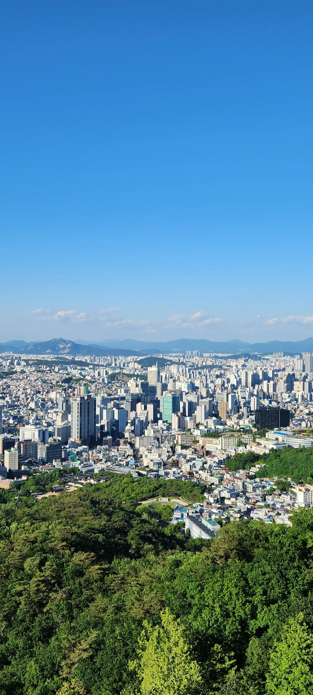 Explore Korea's architectural landscape through stunning phone wallpapers that span centuries of design. From the sleek glass curtain walls of Gangnam's skyscrapers to the raw concrete forms of brutalist apartment complexes, these images capture how Korea blends cutting-edge modernity with bold structural expression.

Look closer and you'll discover geometric patterns in subway station ceilings, sweeping curves of the Dongdaemun Design Plaza, and the quiet symmetry of traditional gate structures standing beside high-rises. Whether you're drawn to minimalist Korean design or dramatic urban geometry, these free aesthetic wallpapers transform your phone background into a gallery of architectural photography., Noksapyeong-daero, Yongsan 2(i)-ga-dong, Seoul — Free Korean aesthetic wallpaper