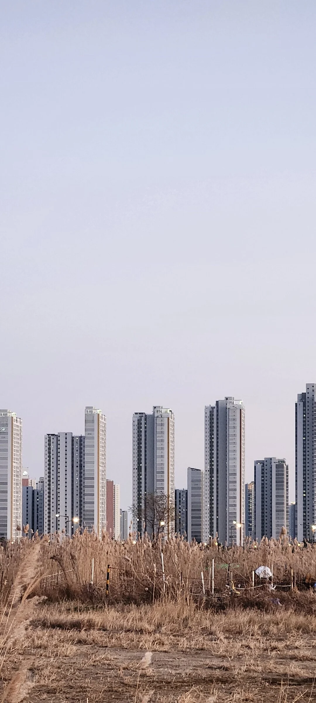 Explore Korea's architectural landscape through stunning phone wallpapers that span centuries of design. From the sleek glass curtain walls of Gangnam's skyscrapers to the raw concrete forms of brutalist apartment complexes, these images capture how Korea blends cutting-edge modernity with bold structural expression.

Look closer and you'll discover geometric patterns in subway station ceilings, sweeping curves of the Dongdaemun Design Plaza, and the quiet symmetry of traditional gate structures standing beside high-rises. Whether you're drawn to minimalist Korean design or dramatic urban geometry, these free aesthetic wallpapers transform your phone background into a gallery of architectural photography., Incheondaegyo Expressway, Songdo 4(sa)-dong, Incheon — Free Korean aesthetic wallpaper