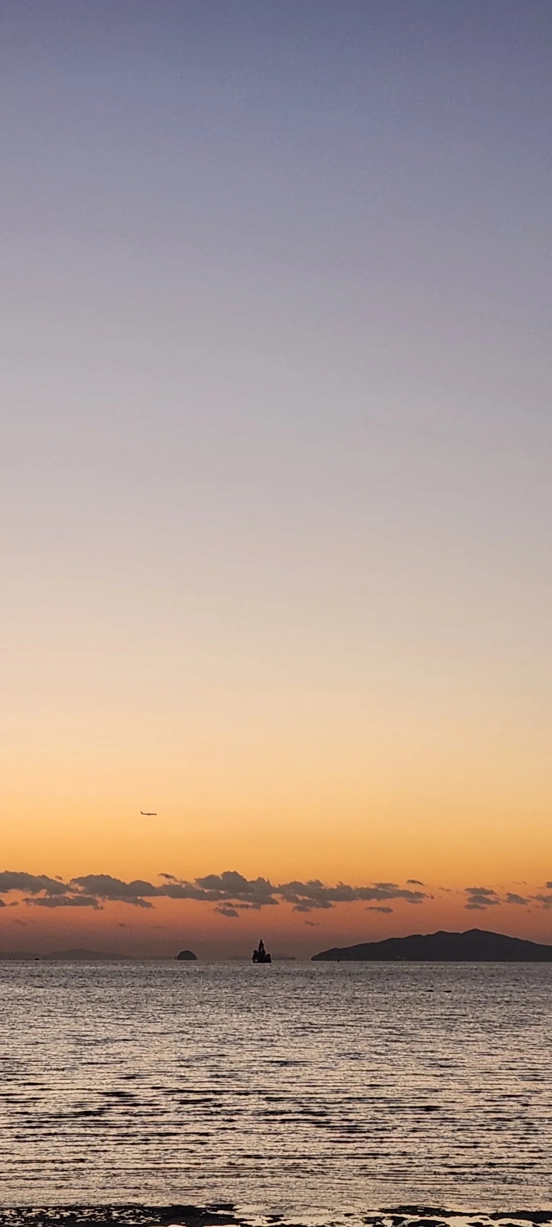 Bring the Korean coastline to your phone with these breathtaking ocean wallpapers. Korea is surrounded by water on three sides, and this collection captures it all — the turquoise shallows of Jeju's beaches, dramatic basalt cliffs plunging into the East Sea, tranquil fishing harbors at dawn, and endless Pacific horizons glowing under golden light.

These photos feature crashing waves against volcanic rock formations, serene island silhouettes at sunset, lighthouse beacons cutting through coastal fog, and the mirror-still surface of sheltered bays reflecting cotton-candy skies. Download these free Korean sea wallpapers for an aesthetic phone background that carries the calm and power of the ocean wherever you go., Incheondaegyo Expressway, Songdo 4(sa)-dong, Incheon — Free Korean aesthetic wallpaper