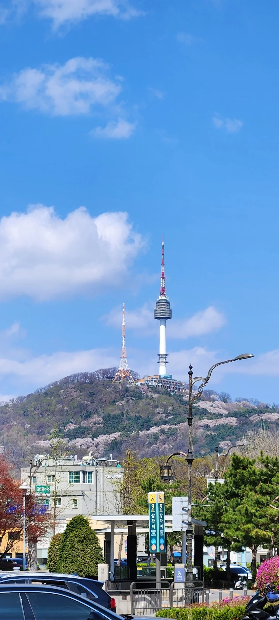 Explore Korea's architectural landscape through stunning phone wallpapers that span centuries of design. From the sleek glass curtain walls of Gangnam's skyscrapers to the raw concrete forms of brutalist apartment complexes, these images capture how Korea blends cutting-edge modernity with bold structural expression.

Look closer and you'll discover geometric patterns in subway station ceilings, sweeping curves of the Dongdaemun Design Plaza, and the quiet symmetry of traditional gate structures standing beside high-rises. Whether you're drawn to minimalist Korean design or dramatic urban geometry, these free aesthetic wallpapers transform your phone background into a gallery of architectural photography., Hangang-daero 57-gil, Hangangno-dong, Seoul — Free Korean aesthetic wallpaper
