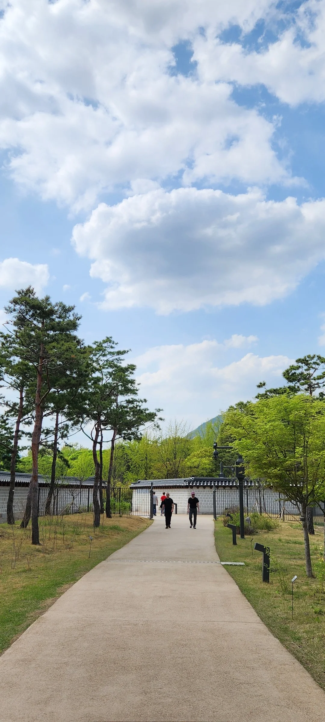 Adorn your phone with the timeless elegance of hanok, Korea's traditional wooden houses. These wallpapers showcase the graceful curved rooflines, hand-carved wooden lattice doors, and serene inner courtyards that have defined Korean residential architecture for centuries. Preserved hanok villages in Bukchon and Jeonju offer a living window into Korea's past.

Each image reveals the quiet beauty of these heritage homes — clay walls weathered to warm earth tones, dark timber frames contrasting with paper-screened windows, stone foundations meeting manicured courtyard gardens, and traditional eaves silhouetted against modern skylines. Download these free hanok wallpapers for an aesthetic phone background that celebrates the harmony between Korean tradition and contemporary life., Yulgok Tunnel, Jongno 1·2·3·4(ilisamsa)-ga-dong, Seoul — Free Korean aesthetic wallpaper