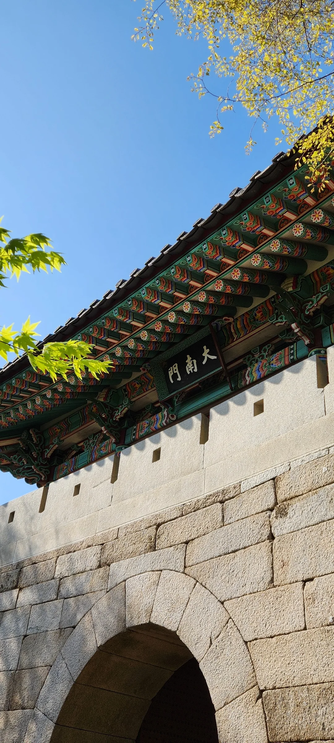 Adorn your phone with the timeless elegance of hanok, Korea's traditional wooden houses. These wallpapers showcase the graceful curved rooflines, hand-carved wooden lattice doors, and serene inner courtyards that have defined Korean residential architecture for centuries. Preserved hanok villages in Bukchon and Jeonju offer a living window into Korea's past.

Each image reveals the quiet beauty of these heritage homes — clay walls weathered to warm earth tones, dark timber frames contrasting with paper-screened windows, stone foundations meeting manicured courtyard gardens, and traditional eaves silhouetted against modern skylines. Download these free hanok wallpapers for an aesthetic phone background that celebrates the harmony between Korean tradition and contemporary life., 연화봉, Hyoja-dong, Goyang-si — Free Korean aesthetic wallpaper