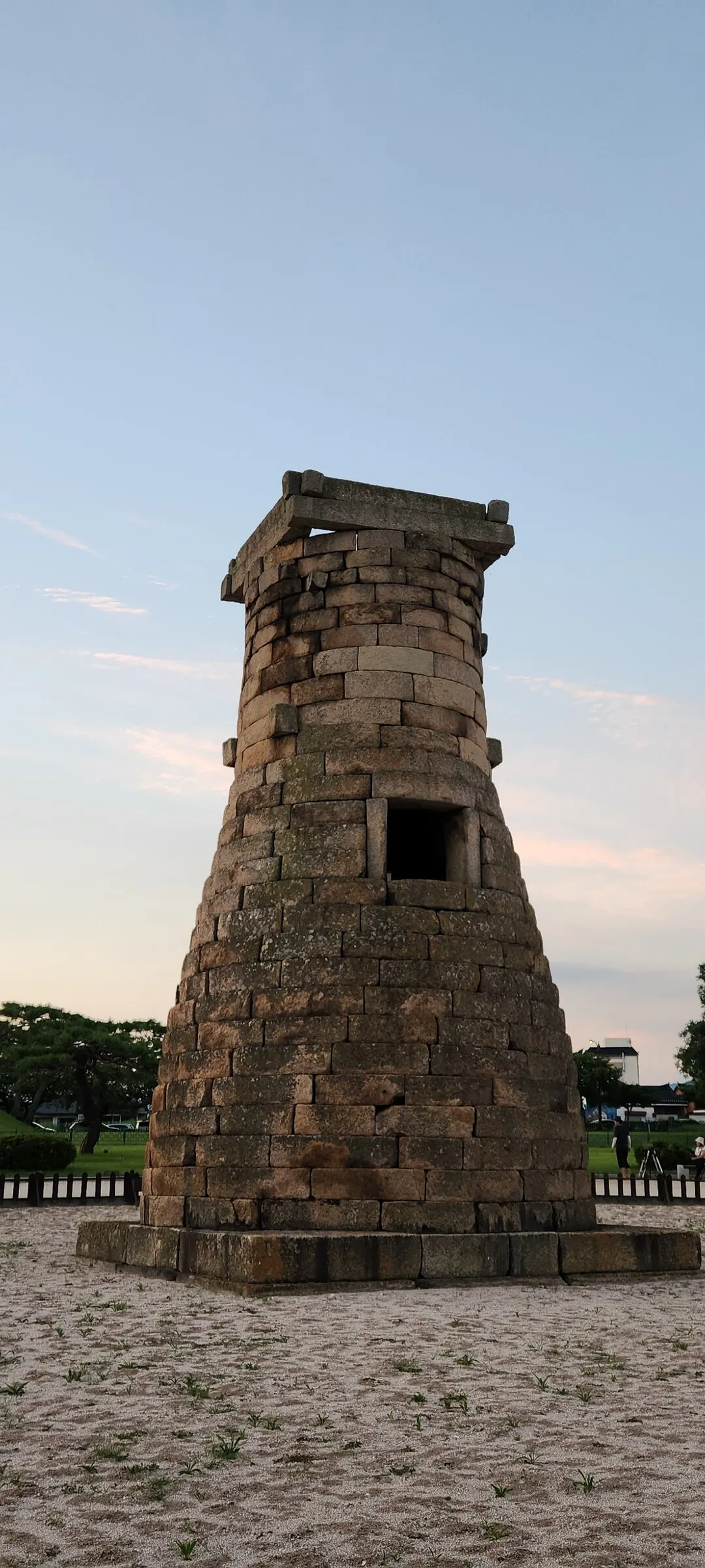 Transform your phone with the inviting green spaces of Korea's parks and gardens. From the sprawling lawns of Olympic Park in Seoul to the meticulously landscaped botanical gardens of the southern coast, these wallpapers capture the beauty of Korea's curated natural spaces — blooming flower beds, reflective lotus ponds, tree-lined promenades, and autumn foliage canopies.

Korean parks are designed for contemplation, and it shows in every image: stone pathways curving around still water, wooden pavilions framed by seasonal color, cherry-blossom tunnels creating pink corridors, and wide meadows where families gather under open skies. Free download these aesthetic park wallpapers and give your phone background the refreshing energy of a Korean garden escape., Cheomseong-ro, Inwang-dong, Wolseong-dong, Gyeongju-si — Free Korean aesthetic wallpaper