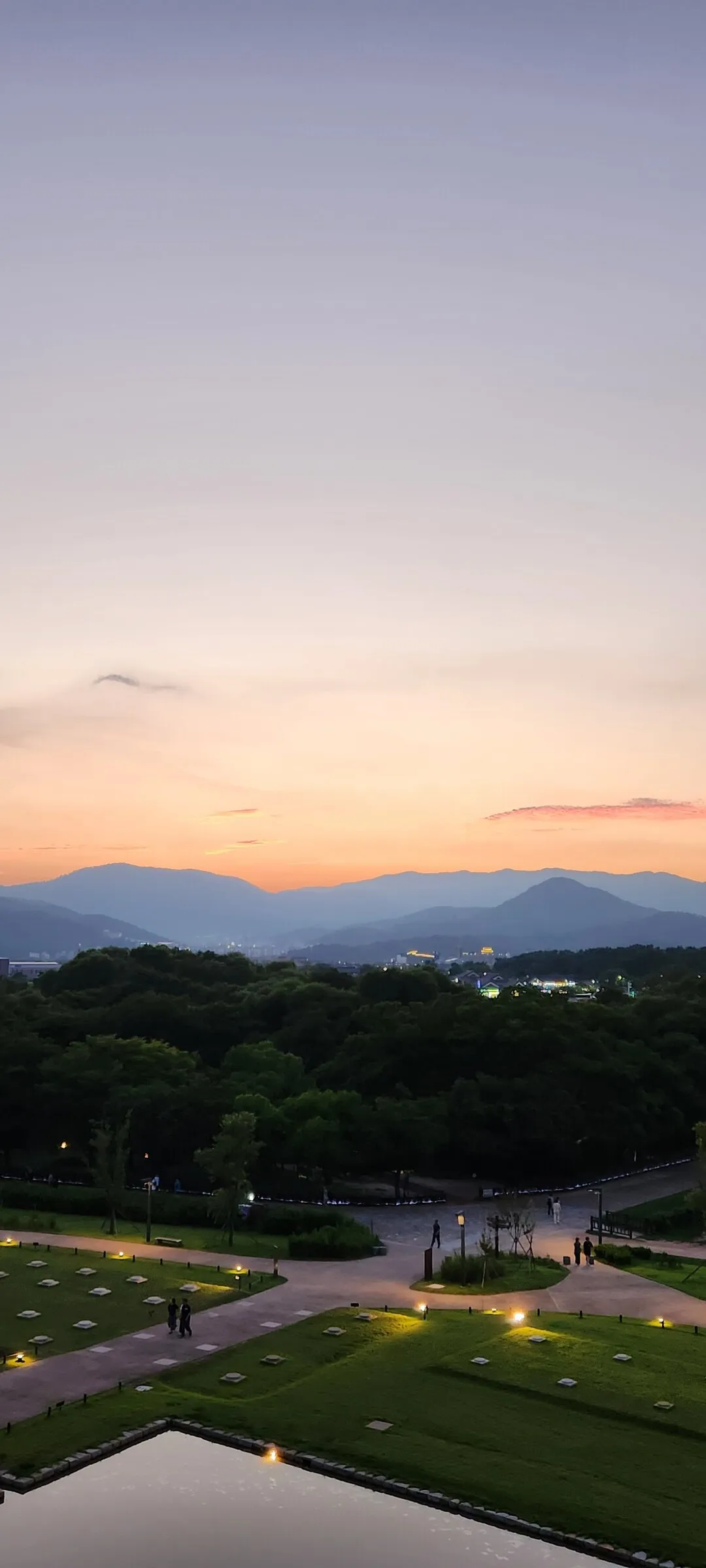 Transform your phone with the inviting green spaces of Korea's parks and gardens. From the sprawling lawns of Olympic Park in Seoul to the meticulously landscaped botanical gardens of the southern coast, these wallpapers capture the beauty of Korea's curated natural spaces — blooming flower beds, reflective lotus ponds, tree-lined promenades, and autumn foliage canopies.

Korean parks are designed for contemplation, and it shows in every image: stone pathways curving around still water, wooden pavilions framed by seasonal color, cherry-blossom tunnels creating pink corridors, and wide meadows where families gather under open skies. Free download these aesthetic park wallpapers and give your phone background the refreshing energy of a Korean garden escape., Inwang-dong, Wolseong-dong, Gyeongju-si — Free Korean aesthetic wallpaper