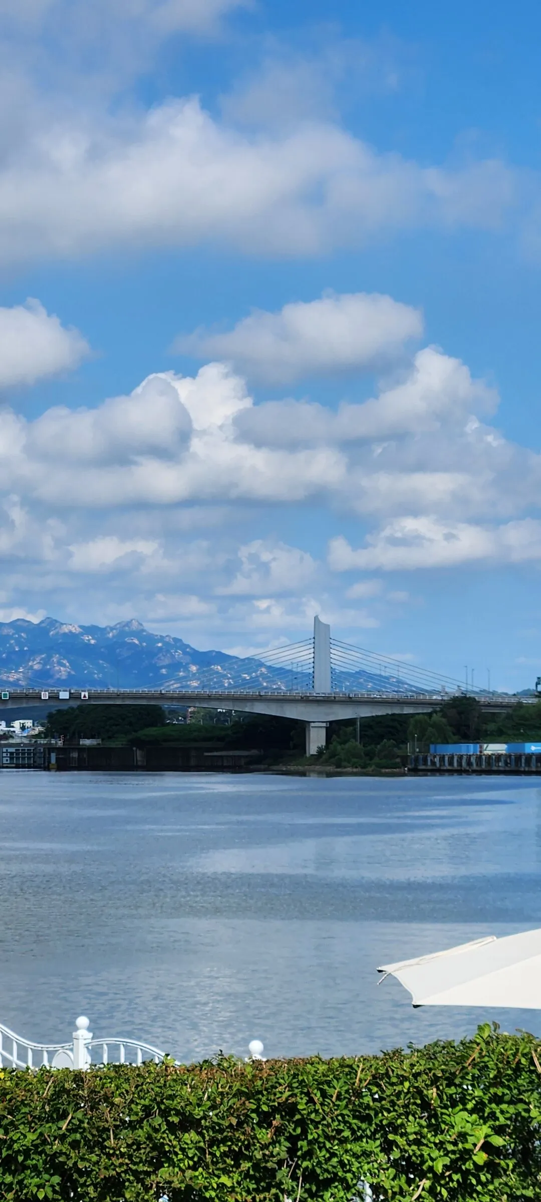 Experience the vibrant pulse of Korean city life through these dynamic street wallpapers. Bustling crosswalks in Myeongdong, colorful shop fronts in Hongdae, rain-slicked sidewalks reflecting neon signs, and everyday moments of commuters, street vendors, and cyclists moving through Seoul's urban rhythm — each image tells a story of a city constantly in motion.

Beyond Seoul, you'll find the charming streetscapes of Busan's hillside neighborhoods, the retro storefronts of Jeonju, and quiet residential lanes where laundry dries on balconies above parked scooters. These free Korean street wallpapers are perfect as an aesthetic phone background for anyone captivated by the raw energy and visual richness of Korean urban culture., Arayuk-ro 230beon-gil, Gimpo-si — Free Korean aesthetic wallpaper