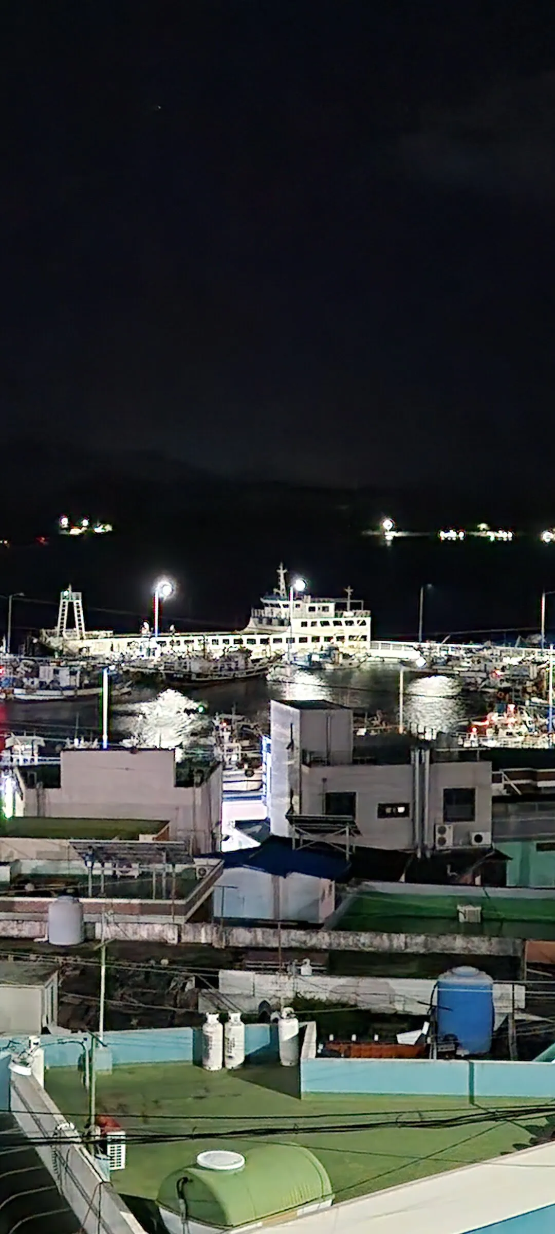 Light up your phone with the electric energy of Seoul after dark. These Korean nightscape wallpapers capture the city at its most cinematic — neon signage stacking up narrow alleyways, glowing street food stalls sending steam into cold night air, illuminated bridges spanning the Han River, and the shimmering towers of Gangnam reflected in rain-wet streets.

Seoul's nighttime personality is bold, colorful, and endlessly photogenic. You'll find the moody glow of Itaewon bars, the cyberpunk atmosphere of Euljiro's industrial blocks, and panoramic cityscapes from hilltop viewpoints where the city stretches to the horizon in every direction. Free download these aesthetic Seoul night wallpapers for a phone background that pulses with urban energy., Sinwol-ro, Sinwol-dong, Yeosu-si — Free Korean aesthetic wallpaper