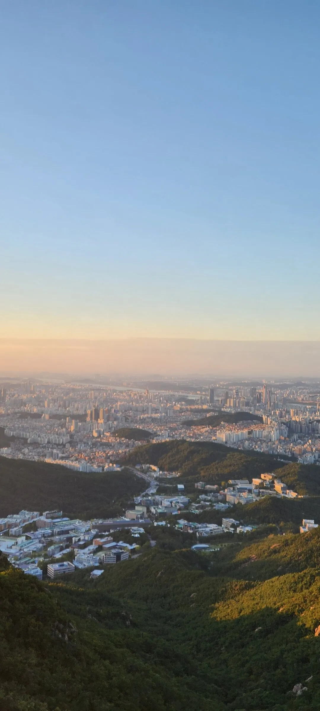 Immerse your screen in the untouched beauty of Korea's natural world. These Korean wallpapers feature sweeping countryside fields blanketed in green, hidden valleys where morning mist clings to the hillsides, and winding streams cutting through rocky terrain. Each photo captures the raw, peaceful energy that makes Korea's landscapes so distinctive.

From the volcanic plains of Jeju Island to the lush wetlands of Suncheon Bay, this collection showcases nature in every mood — dramatic storm clouds rolling over ridgelines, golden sunlight filtering through canopy gaps, and wildflower meadows stretching toward distant peaks. Download these aesthetic phone backgrounds for free and bring a moment of Korean tranquility to your daily life., Daehak-dong, Seoul — Free Korean aesthetic wallpaper