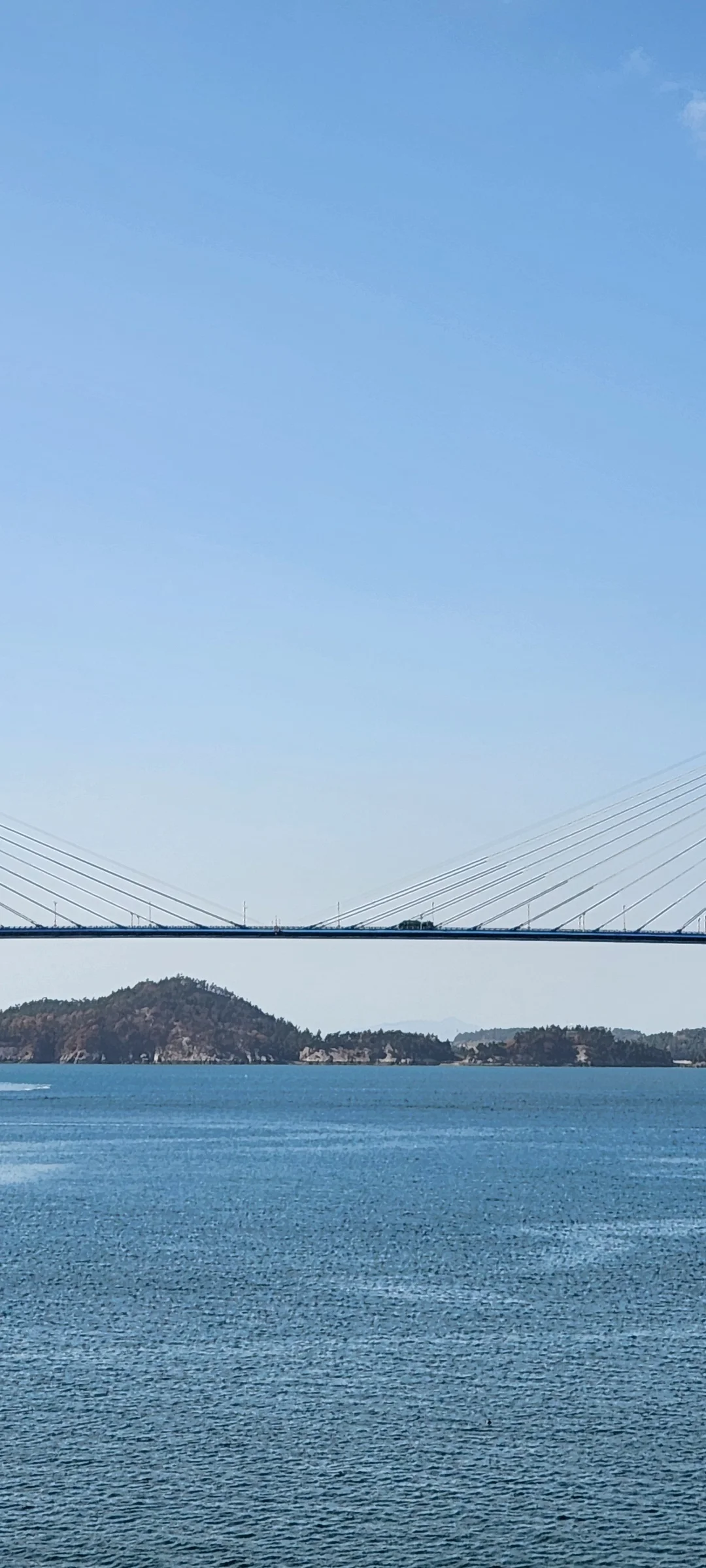 Bring the Korean coastline to your phone with these breathtaking ocean wallpapers. Korea is surrounded by water on three sides, and this collection captures it all — the turquoise shallows of Jeju's beaches, dramatic basalt cliffs plunging into the East Sea, tranquil fishing harbors at dawn, and endless Pacific horizons glowing under golden light.

These photos feature crashing waves against volcanic rock formations, serene island silhouettes at sunset, lighthouse beacons cutting through coastal fog, and the mirror-still surface of sheltered bays reflecting cotton-candy skies. Download these free Korean sea wallpapers for an aesthetic phone background that carries the calm and power of the ocean wherever you go., Mokpo-si, Jeollanam-do — Free Korean aesthetic wallpaper