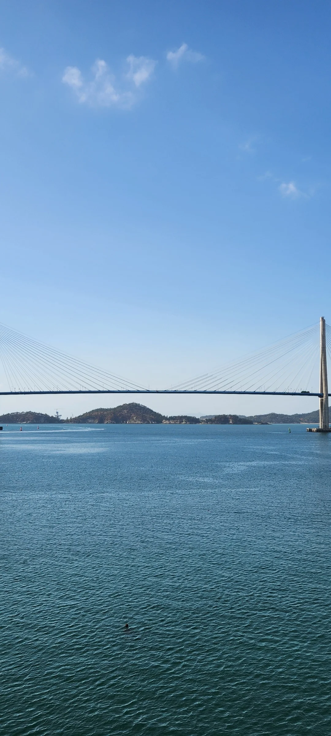 Bring the Korean coastline to your phone with these breathtaking ocean wallpapers. Korea is surrounded by water on three sides, and this collection captures it all — the turquoise shallows of Jeju's beaches, dramatic basalt cliffs plunging into the East Sea, tranquil fishing harbors at dawn, and endless Pacific horizons glowing under golden light.

These photos feature crashing waves against volcanic rock formations, serene island silhouettes at sunset, lighthouse beacons cutting through coastal fog, and the mirror-still surface of sheltered bays reflecting cotton-candy skies. Download these free Korean sea wallpapers for an aesthetic phone background that carries the calm and power of the ocean wherever you go., Mokpo-si, Jeollanam-do — Free Korean aesthetic wallpaper