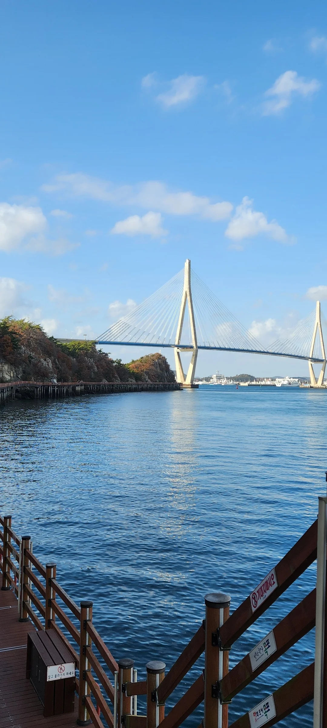 Bring the Korean coastline to your phone with these breathtaking ocean wallpapers. Korea is surrounded by water on three sides, and this collection captures it all — the turquoise shallows of Jeju's beaches, dramatic basalt cliffs plunging into the East Sea, tranquil fishing harbors at dawn, and endless Pacific horizons glowing under golden light.

These photos feature crashing waves against volcanic rock formations, serene island silhouettes at sunset, lighthouse beacons cutting through coastal fog, and the mirror-still surface of sheltered bays reflecting cotton-candy skies. Download these free Korean sea wallpapers for an aesthetic phone background that carries the calm and power of the ocean wherever you go., Mokpo-si, Jeollanam-do — Free Korean aesthetic wallpaper