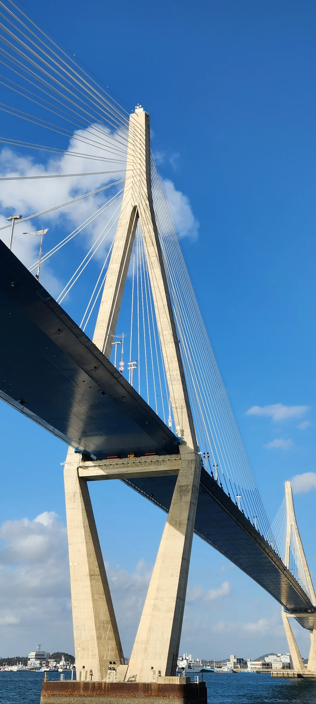 Bring the Korean coastline to your phone with these breathtaking ocean wallpapers. Korea is surrounded by water on three sides, and this collection captures it all — the turquoise shallows of Jeju's beaches, dramatic basalt cliffs plunging into the East Sea, tranquil fishing harbors at dawn, and endless Pacific horizons glowing under golden light.

These photos feature crashing waves against volcanic rock formations, serene island silhouettes at sunset, lighthouse beacons cutting through coastal fog, and the mirror-still surface of sheltered bays reflecting cotton-candy skies. Download these free Korean sea wallpapers for an aesthetic phone background that carries the calm and power of the ocean wherever you go., Mokpo-si, Jeollanam-do — Free Korean aesthetic wallpaper