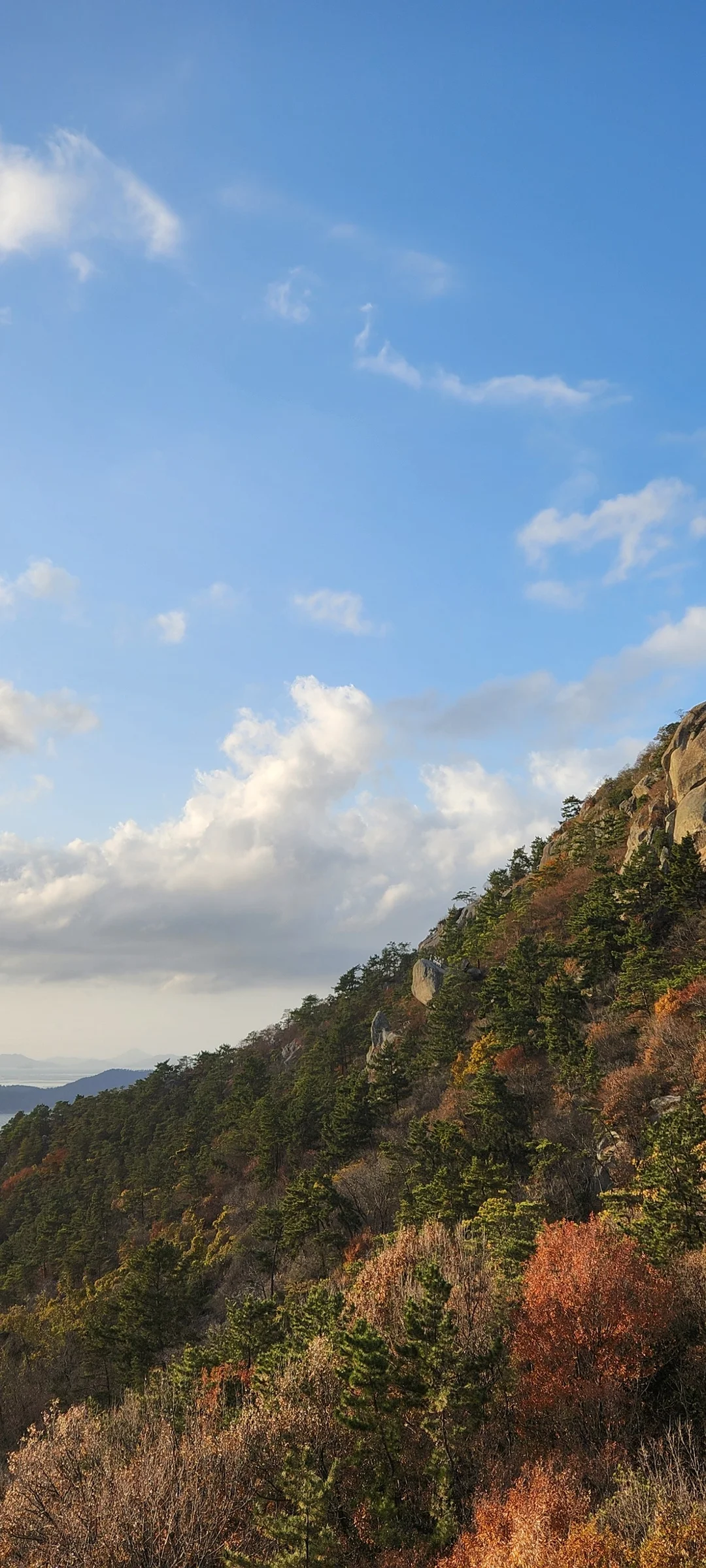 Set your phone against the majestic backdrop of Korea's mountain ranges. The Korean peninsula is nearly 70% mountainous, and these wallpapers celebrate that dramatic terrain — jagged granite peaks rising above the clouds, ancient fortress walls tracing ridgelines, and forest trails disappearing into autumn-colored valleys.

From the iconic rocky summits of Bukhansan in Seoul to the remote alpine meadows of Seoraksan, each image captures the scale and serenity of Korean mountain landscapes across all four seasons. Snow-dusted winter peaks, spring azalea blooms on hillsides, summer greenery, and fiery fall foliage are all here. Free download these aesthetic mountain wallpapers and carry Korea's highland grandeur in your pocket., Mokpo-si, Jeollanam-do — Free Korean aesthetic wallpaper
